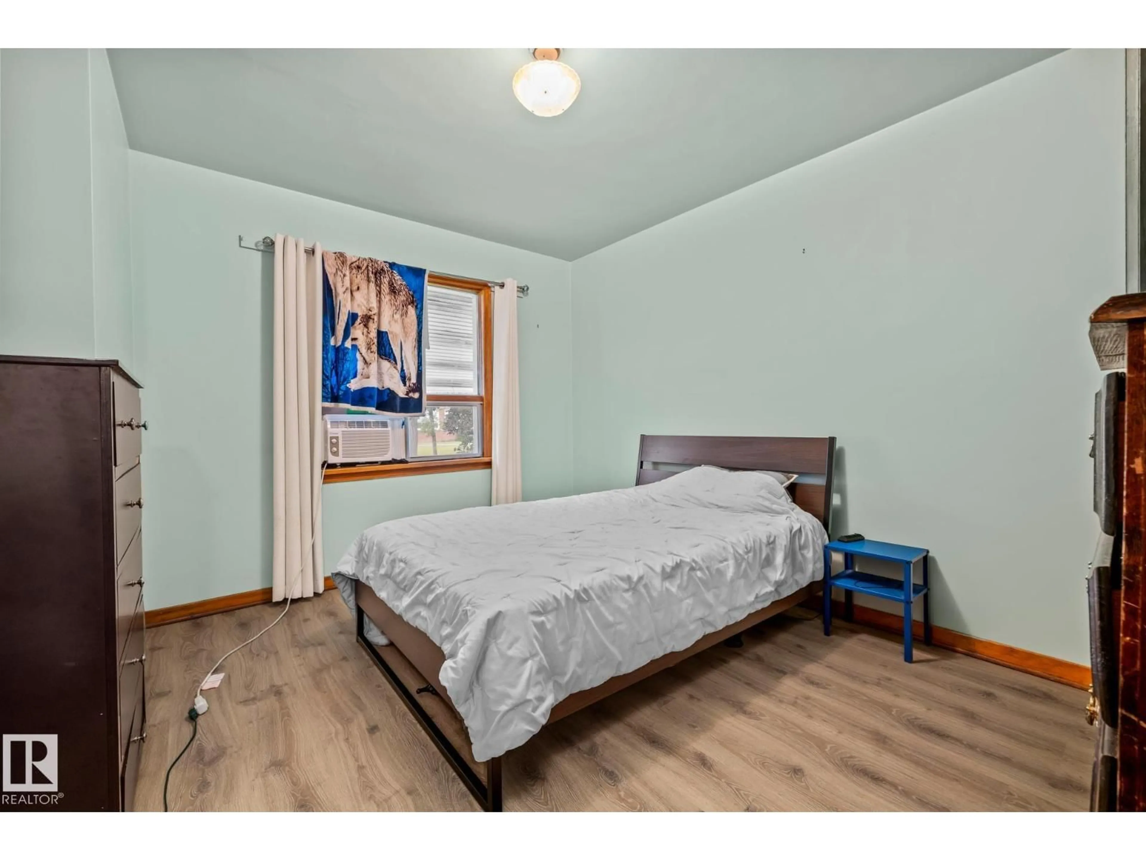 Bedroom with bed, wood/laminate floor for NW - 11505 68 ST, Edmonton Alberta T5B1P2