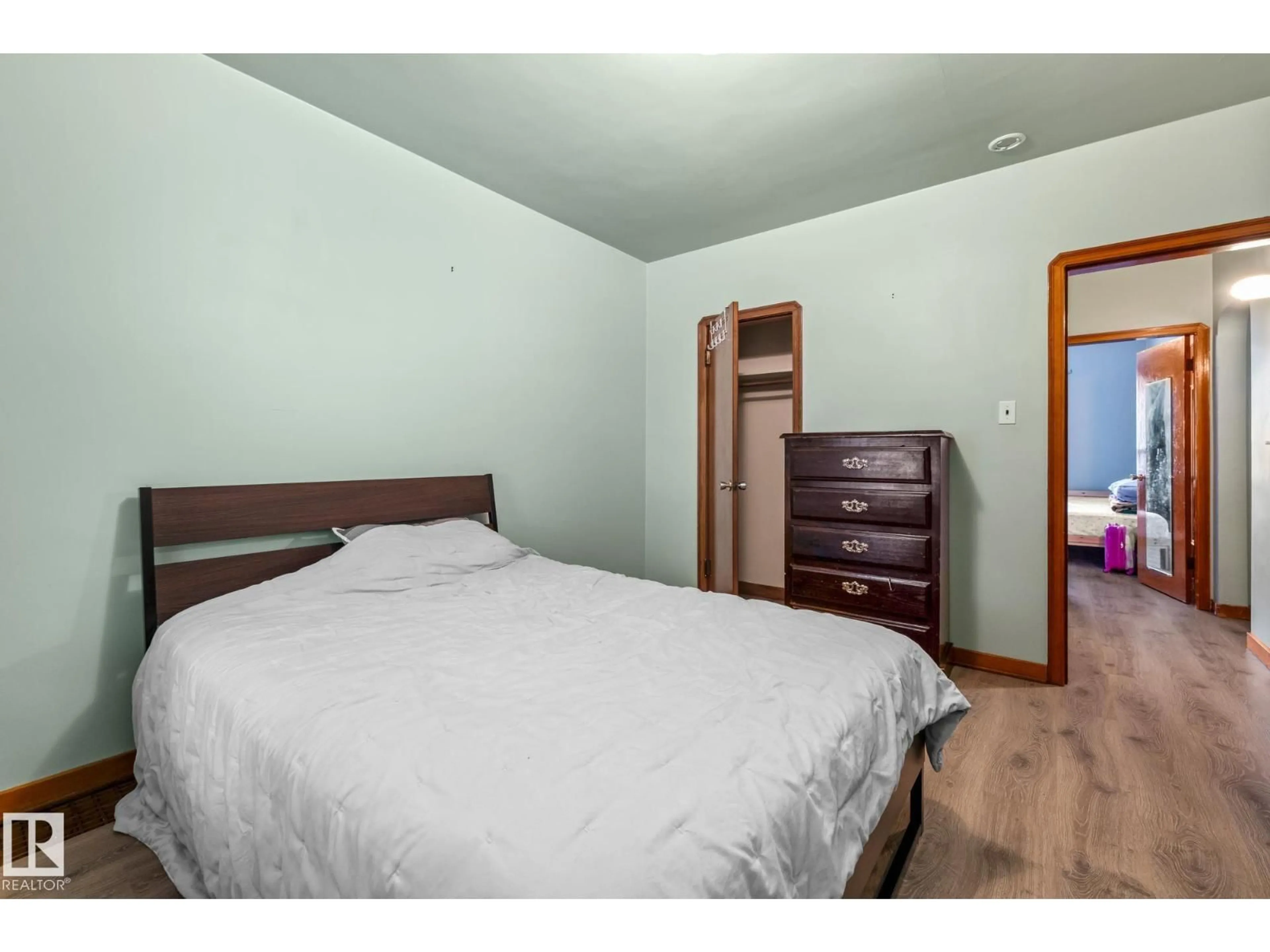 Bedroom with bed, wood/laminate floor for NW - 11505 68 ST, Edmonton Alberta T5B1P2