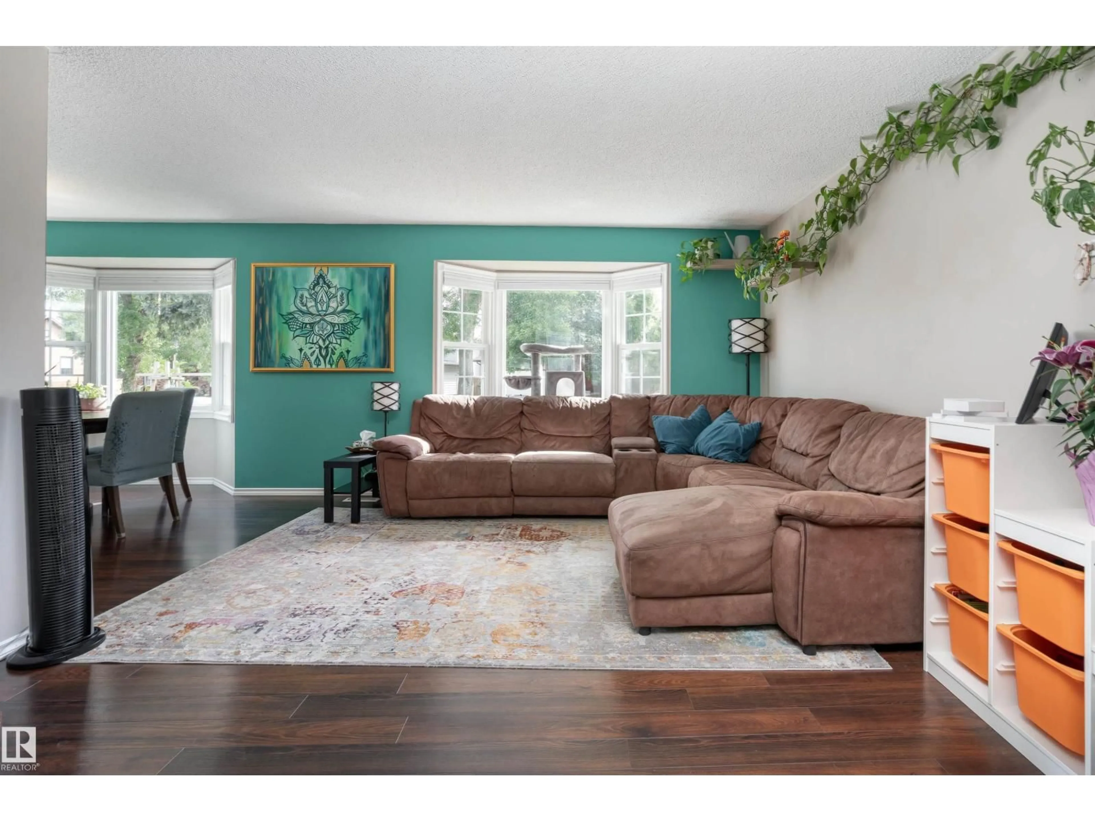 Living room with furniture, wood/laminate floor for 20 WOODLAKE RD, Sherwood Park Alberta T8A4B7