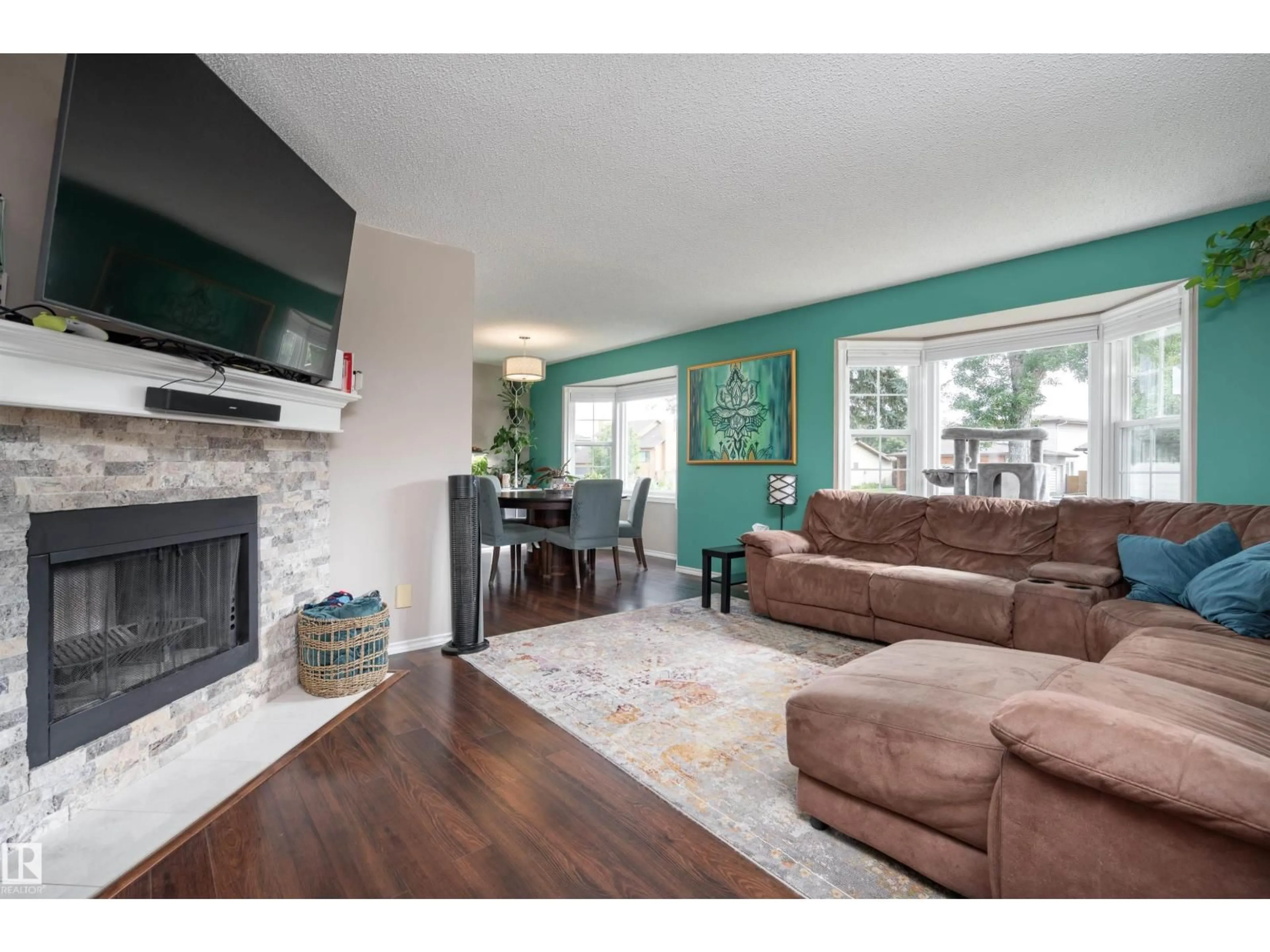 Living room with furniture, wood/laminate floor for 20 WOODLAKE RD, Sherwood Park Alberta T8A4B7
