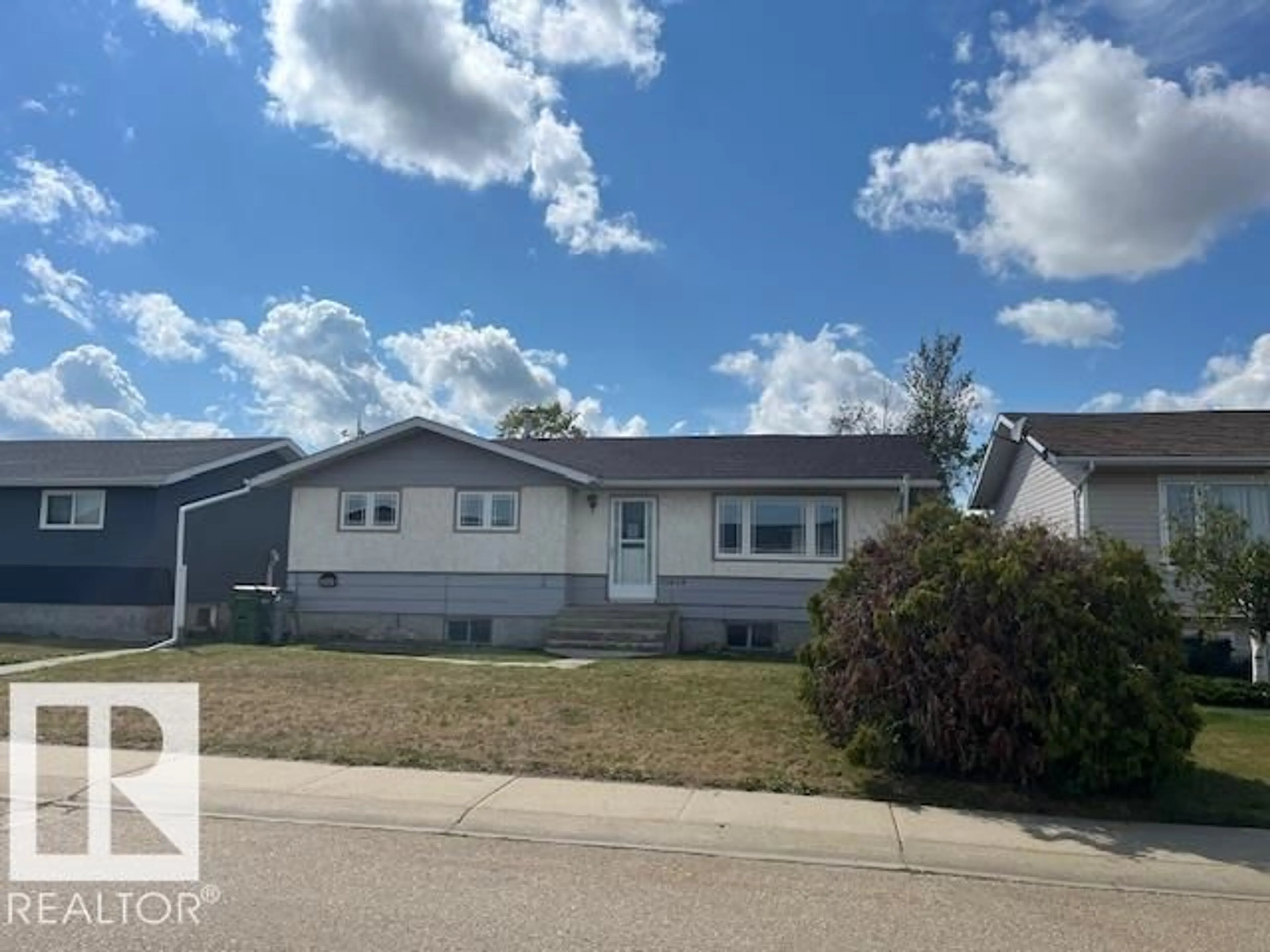 Home with vinyl exterior material, street for 10424 110 AV, Westlock Alberta T7P1G2