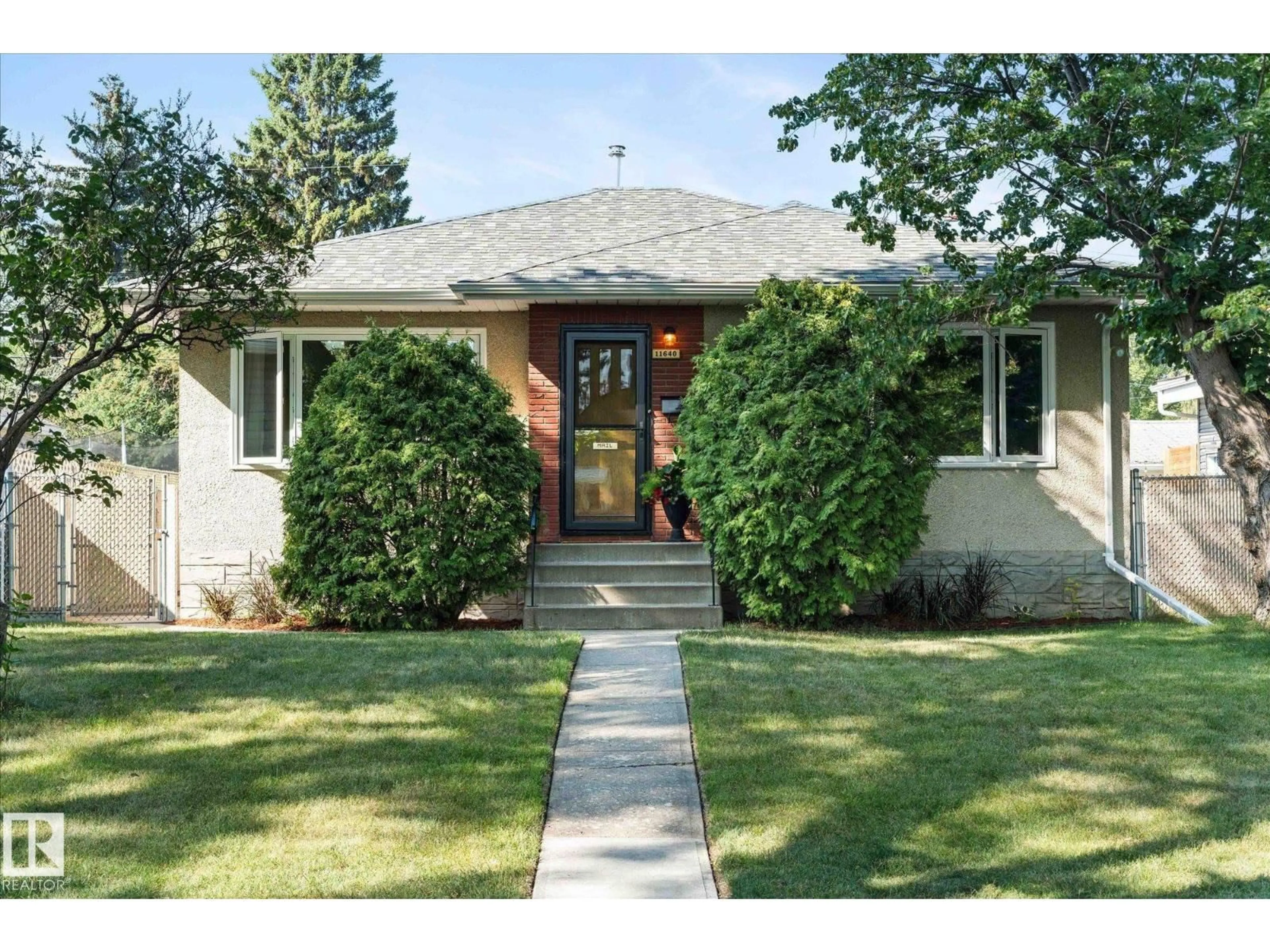 Home with brick exterior material, street for NW - 11640 136 ST, Edmonton Alberta T5M1M8