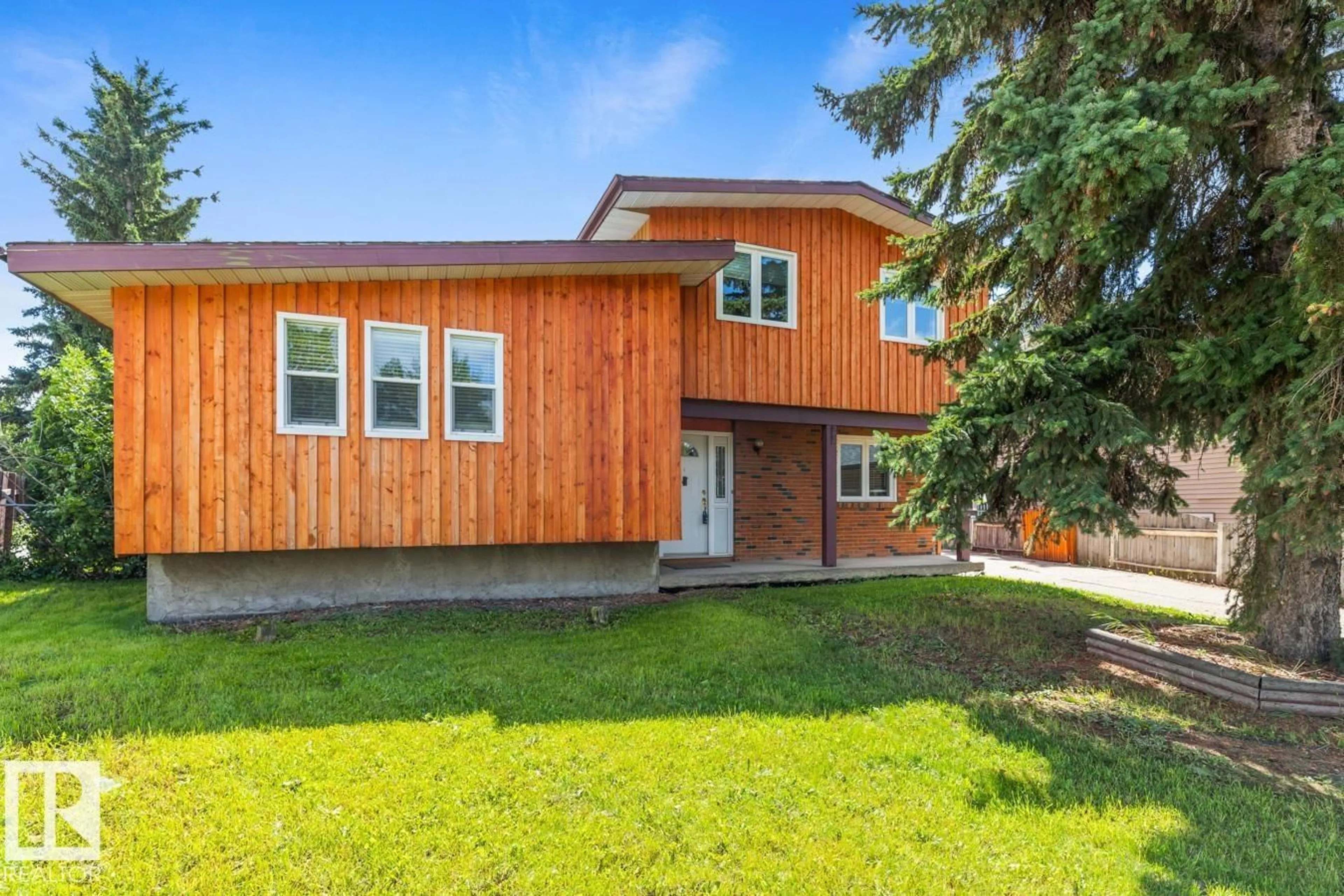 Home with vinyl exterior material, street for 8511 24 AV, Edmonton Alberta T6K2W3