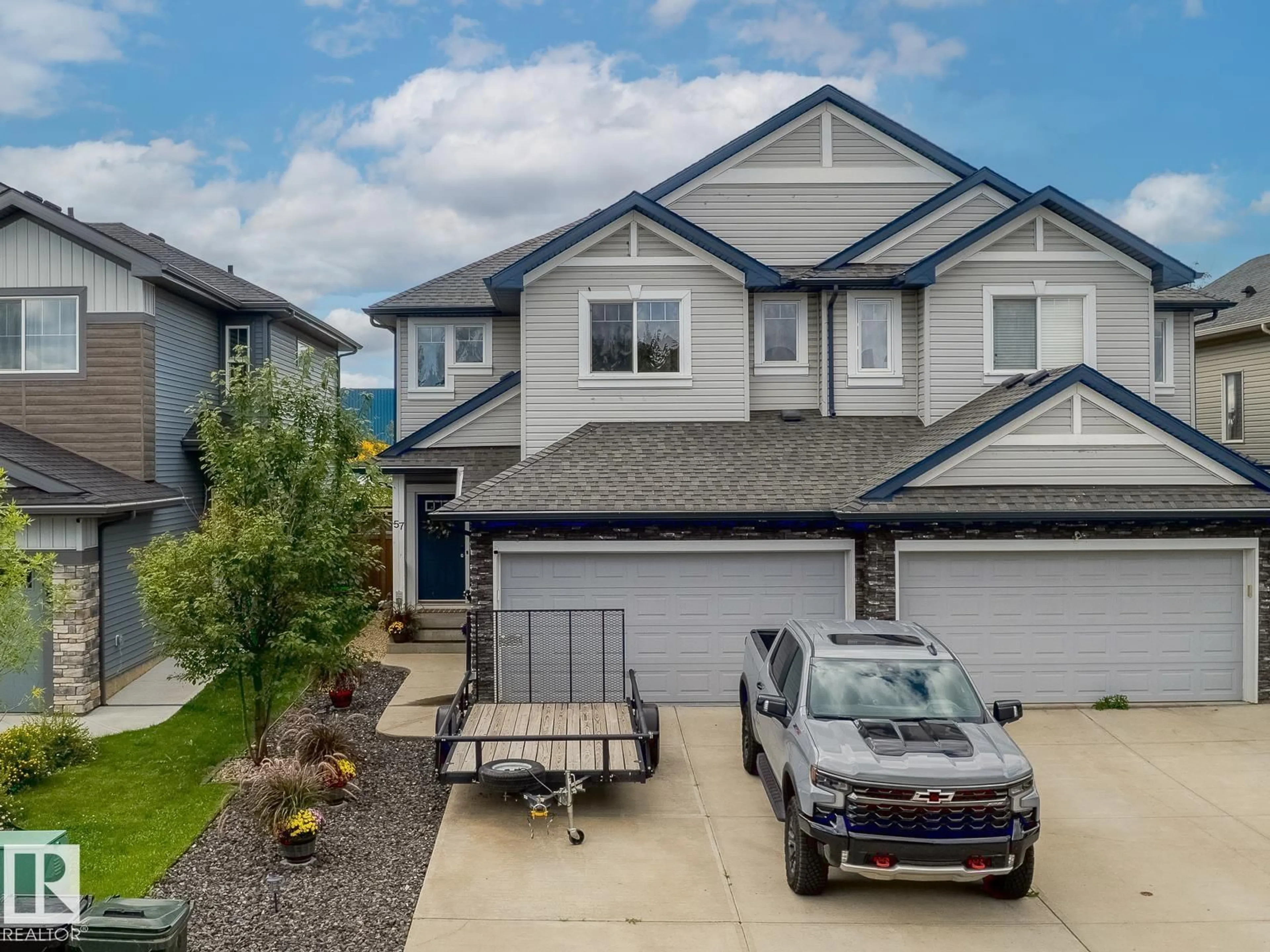 A pic from outside/outdoor area/front of a property/back of a property/a pic from drone, street for 57 MEADOWLAND CR, Spruce Grove Alberta T7X0P9