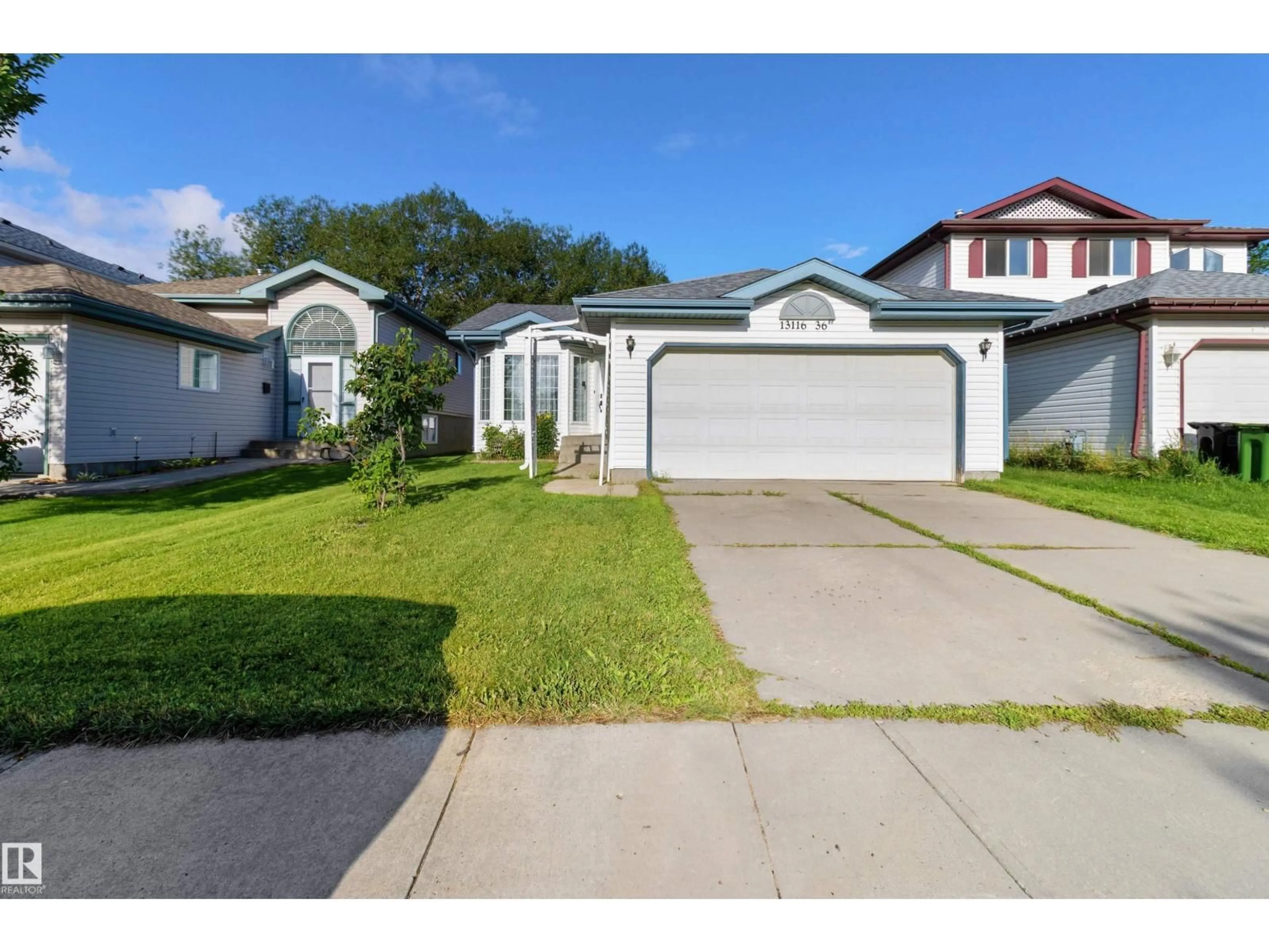 Home with vinyl exterior material, street for 13116 36 ST, Edmonton Alberta T5A5C7