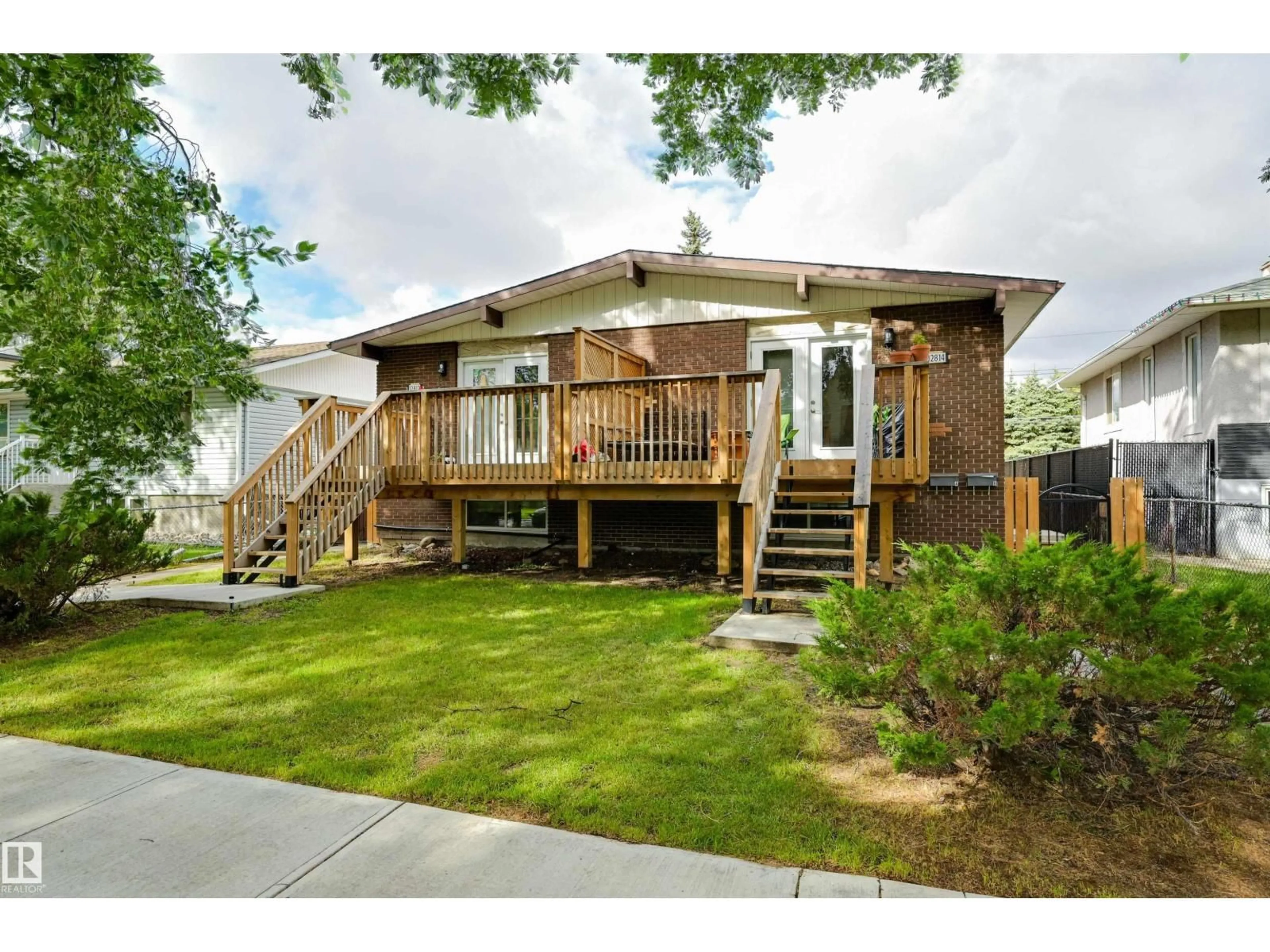 Home with vinyl exterior material, street for NW - 12812 +12814 125 ST, Edmonton Alberta T5L0T9