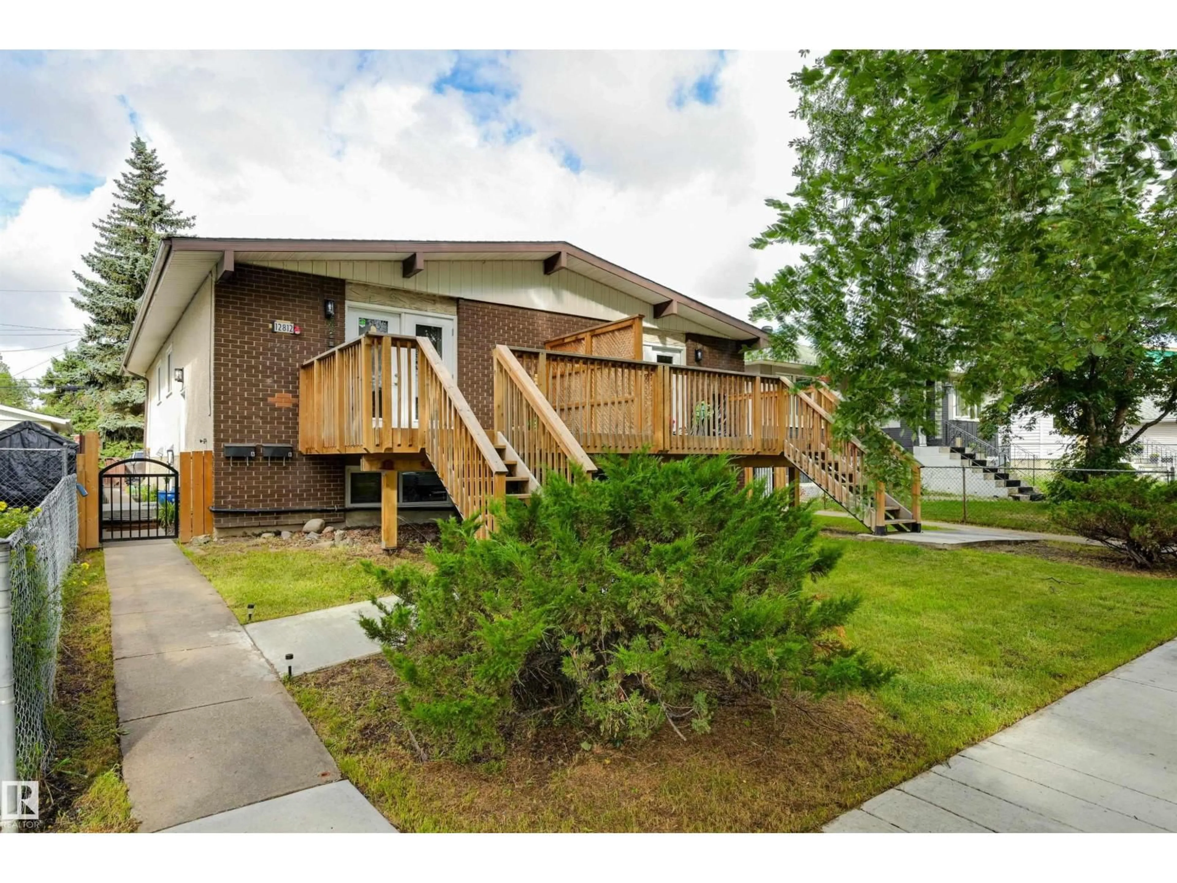 Home with vinyl exterior material, street for NW - 12812 +12814 125 ST, Edmonton Alberta T5L0T9