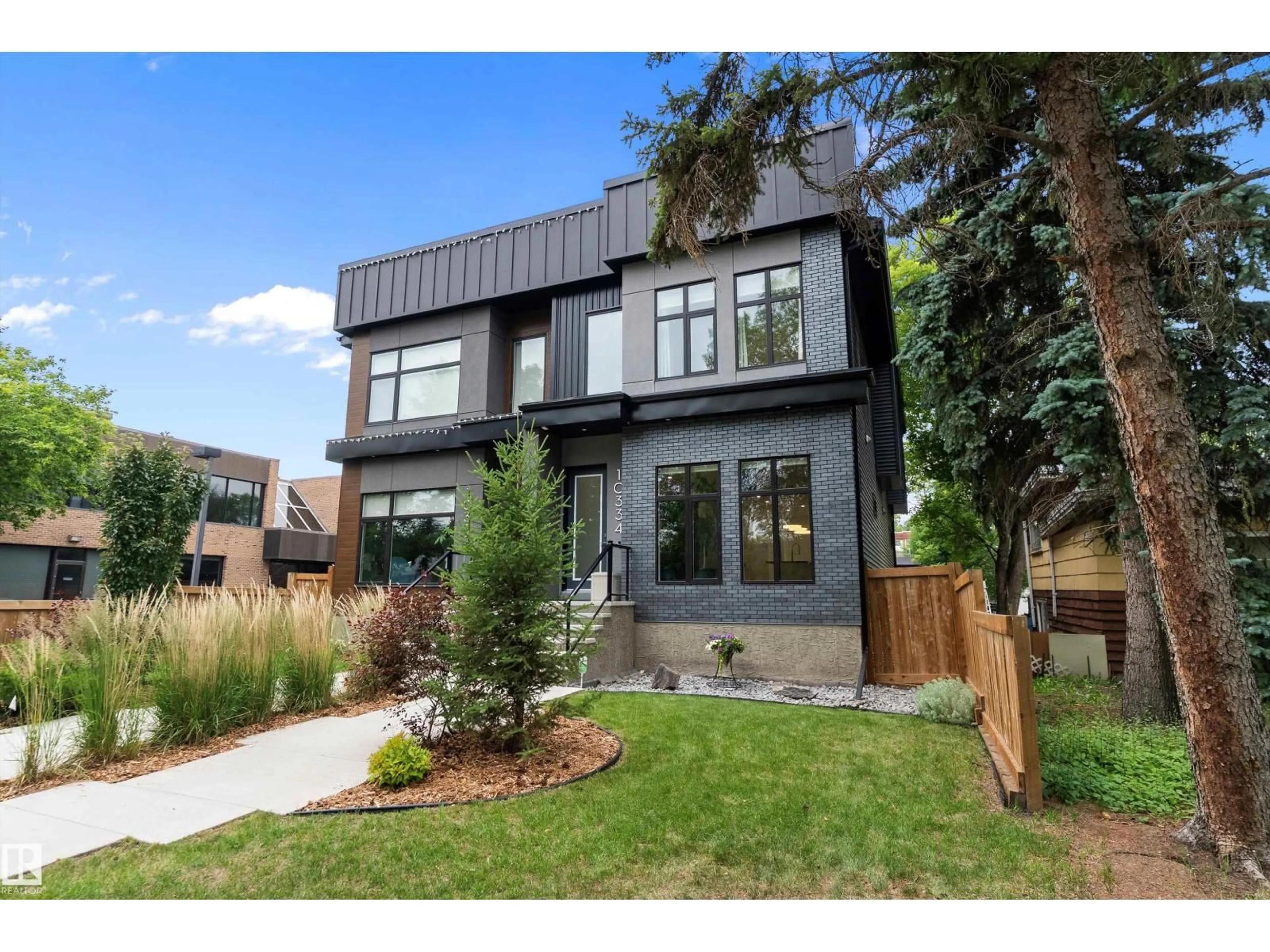 Home with brick exterior material, street for NW - 10334 146 ST, Edmonton Alberta T5N3A2