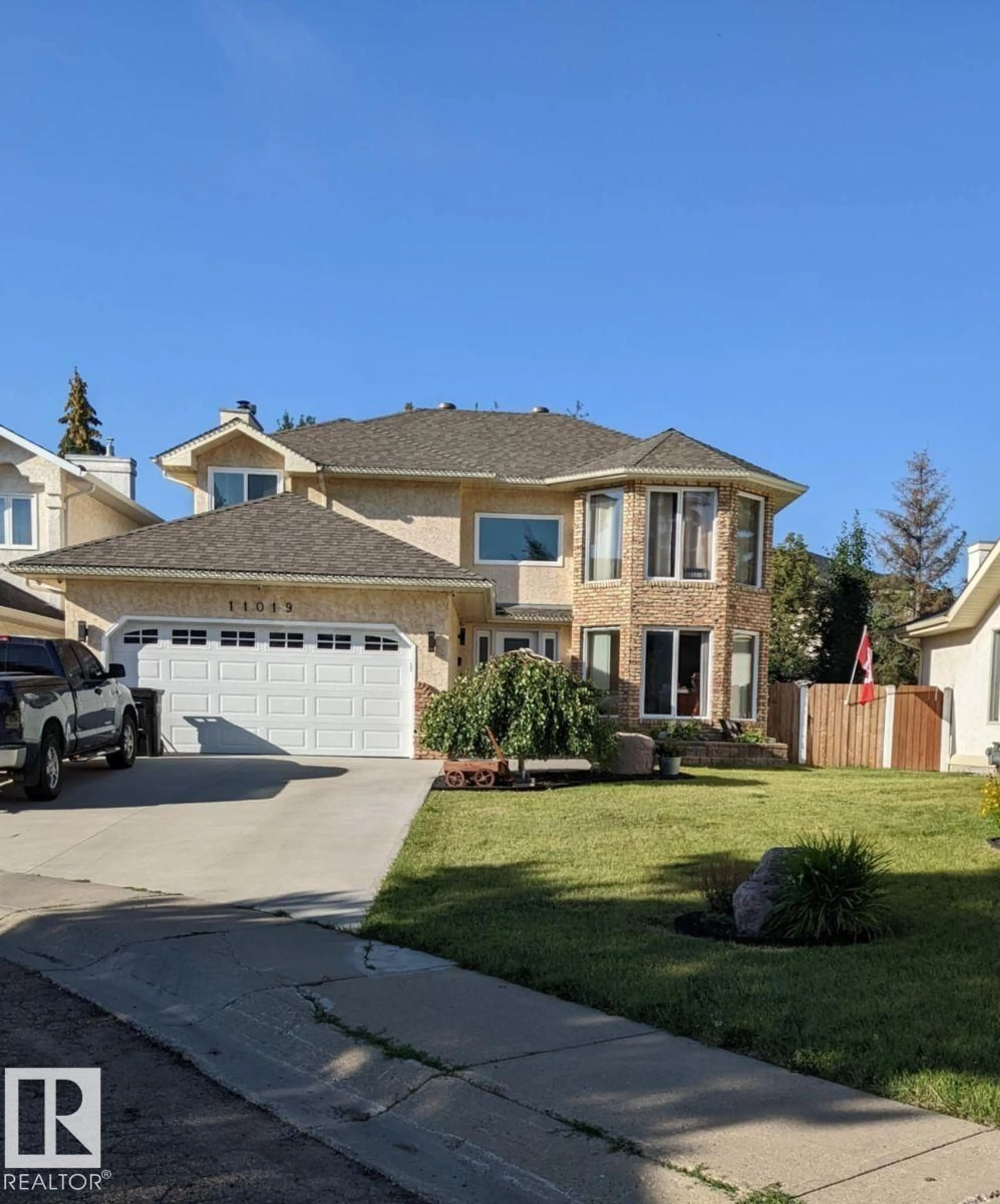 Home with vinyl exterior material, street for 11019 10 AV, Edmonton Alberta T6J6N4