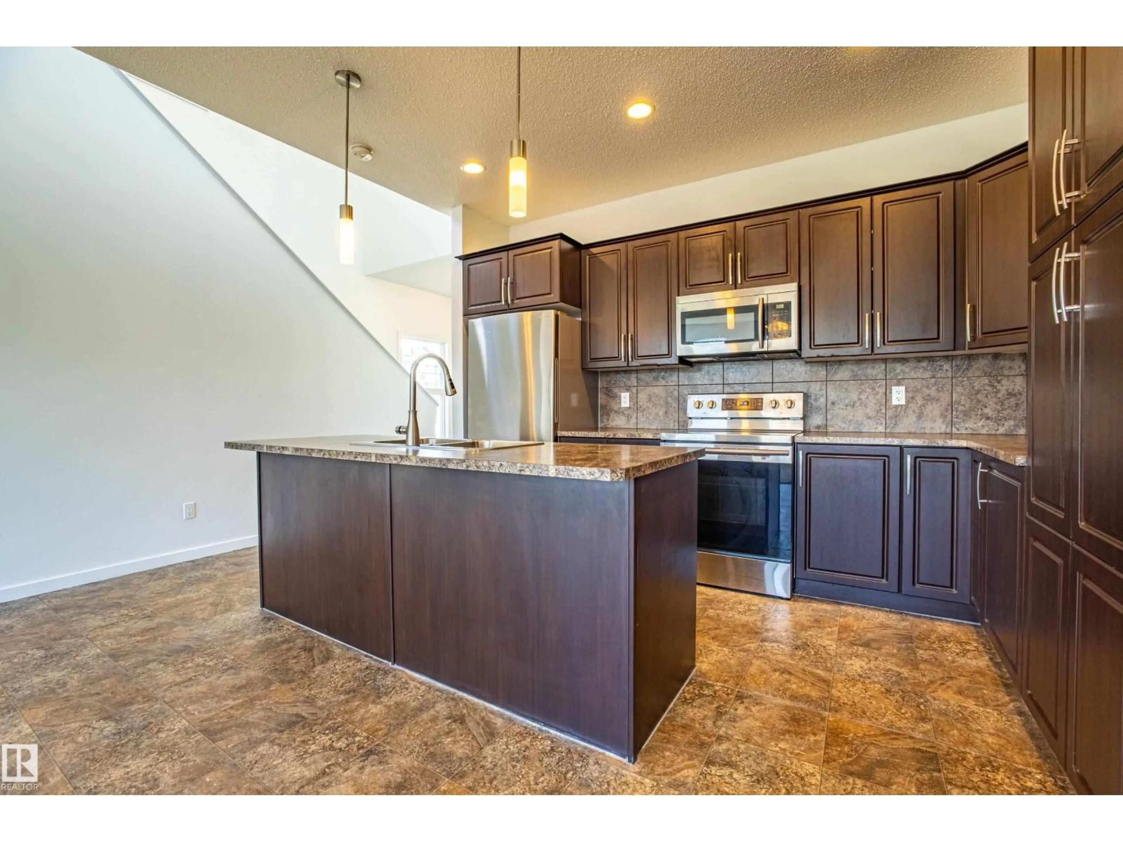 Open concept kitchen, ceramic/tile floor for 4062 ALEXANDER WY, Edmonton Alberta T6W2C6