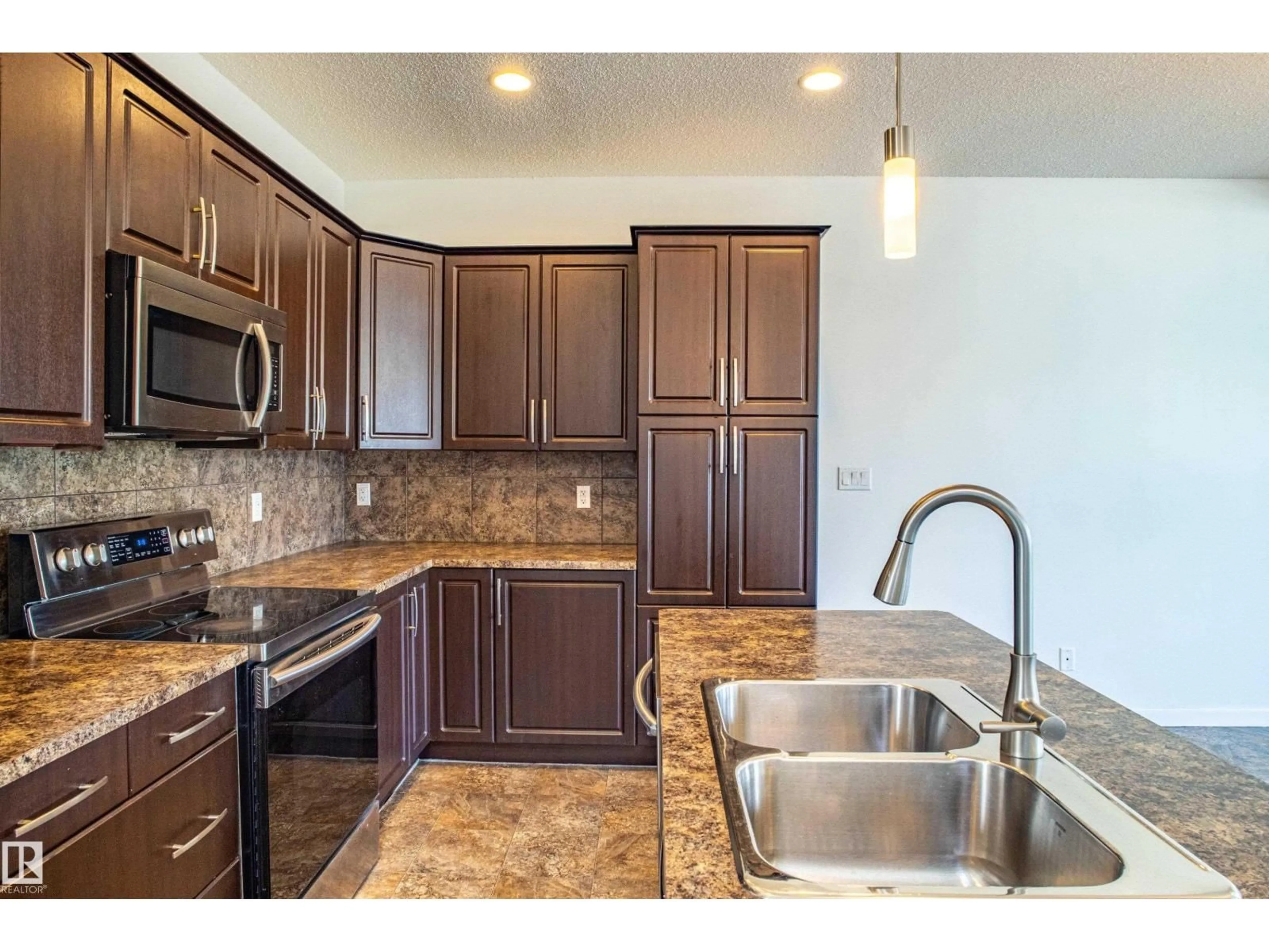 Open concept kitchen, ceramic/tile floor for 4062 ALEXANDER WY, Edmonton Alberta T6W2C6
