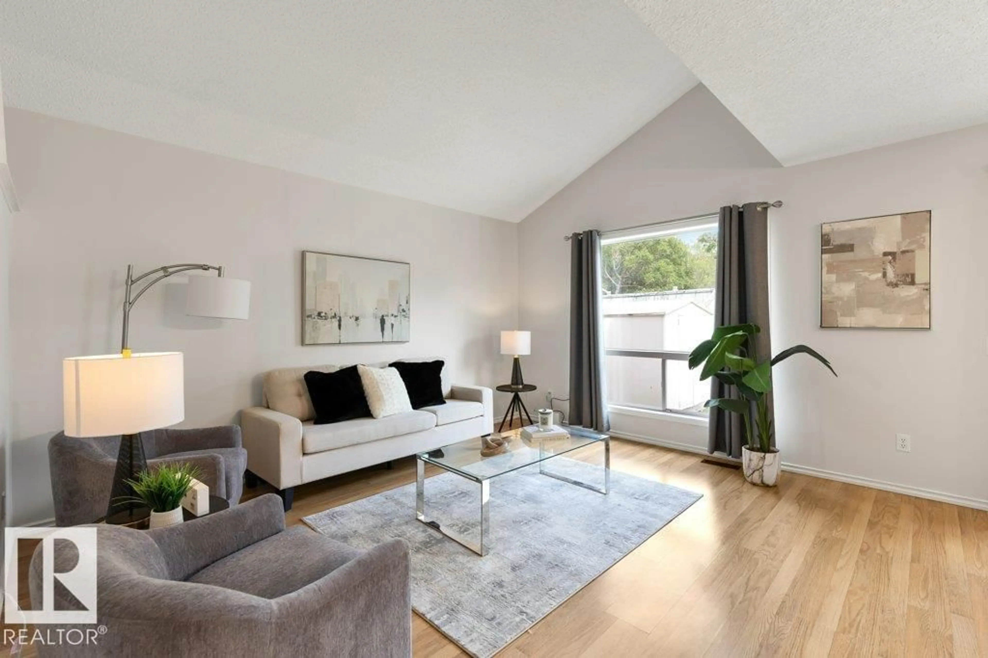 Living room with furniture, wood/laminate floor for 18 HAWTHORNE CR, St. Albert Alberta T8N6N5