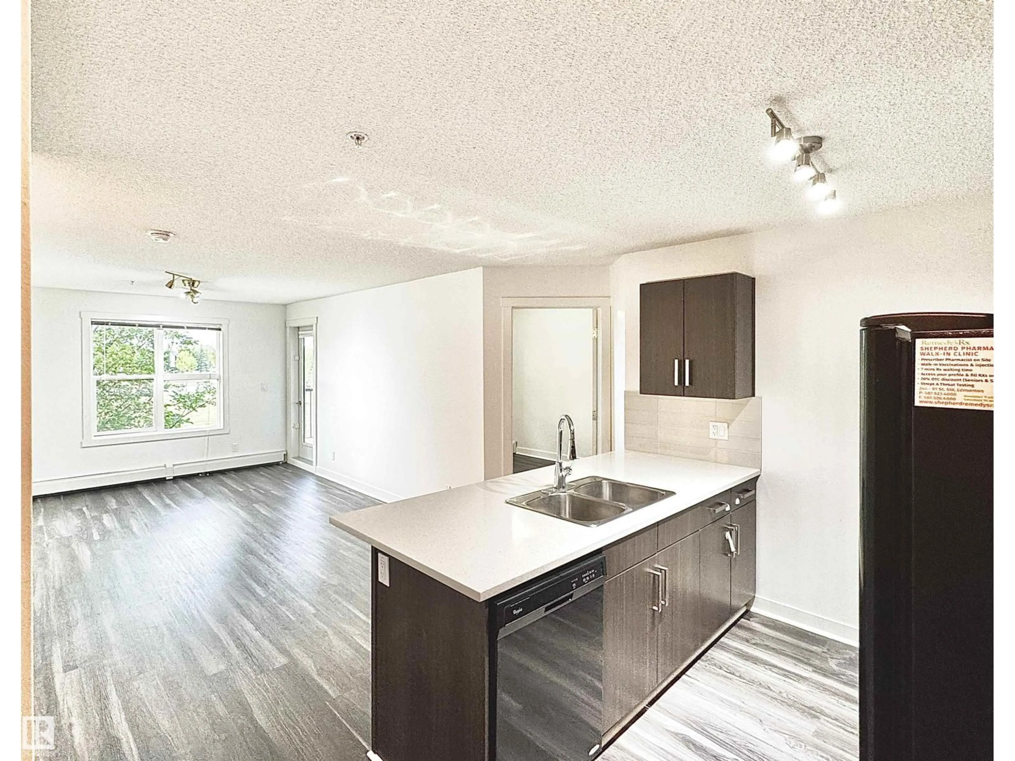Open concept kitchen, wood/laminate floor for 206 WATT BV, Edmonton Alberta T6X0Y2