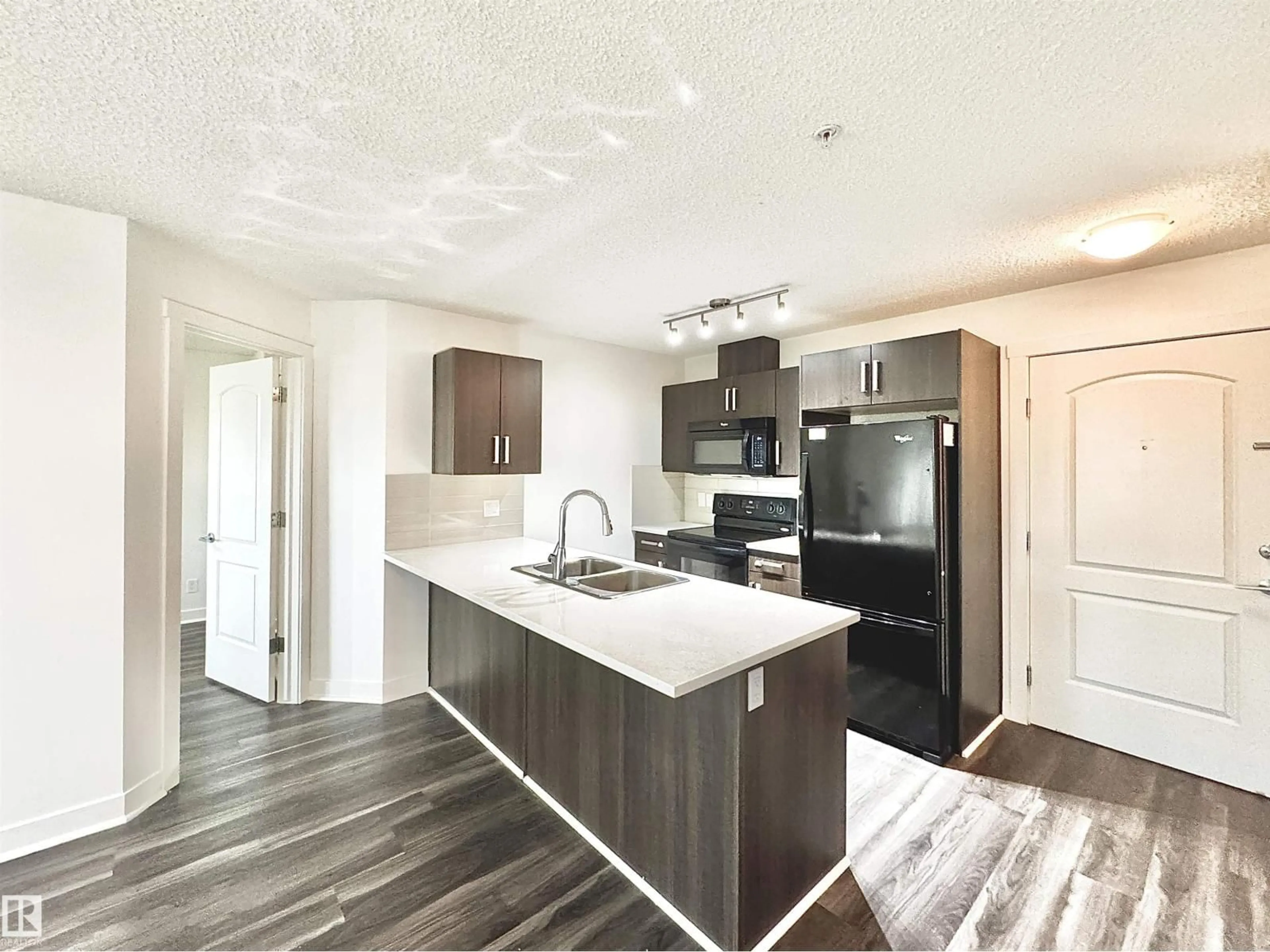 Open concept kitchen, wood/laminate floor for 206 WATT BV, Edmonton Alberta T6X0Y2
