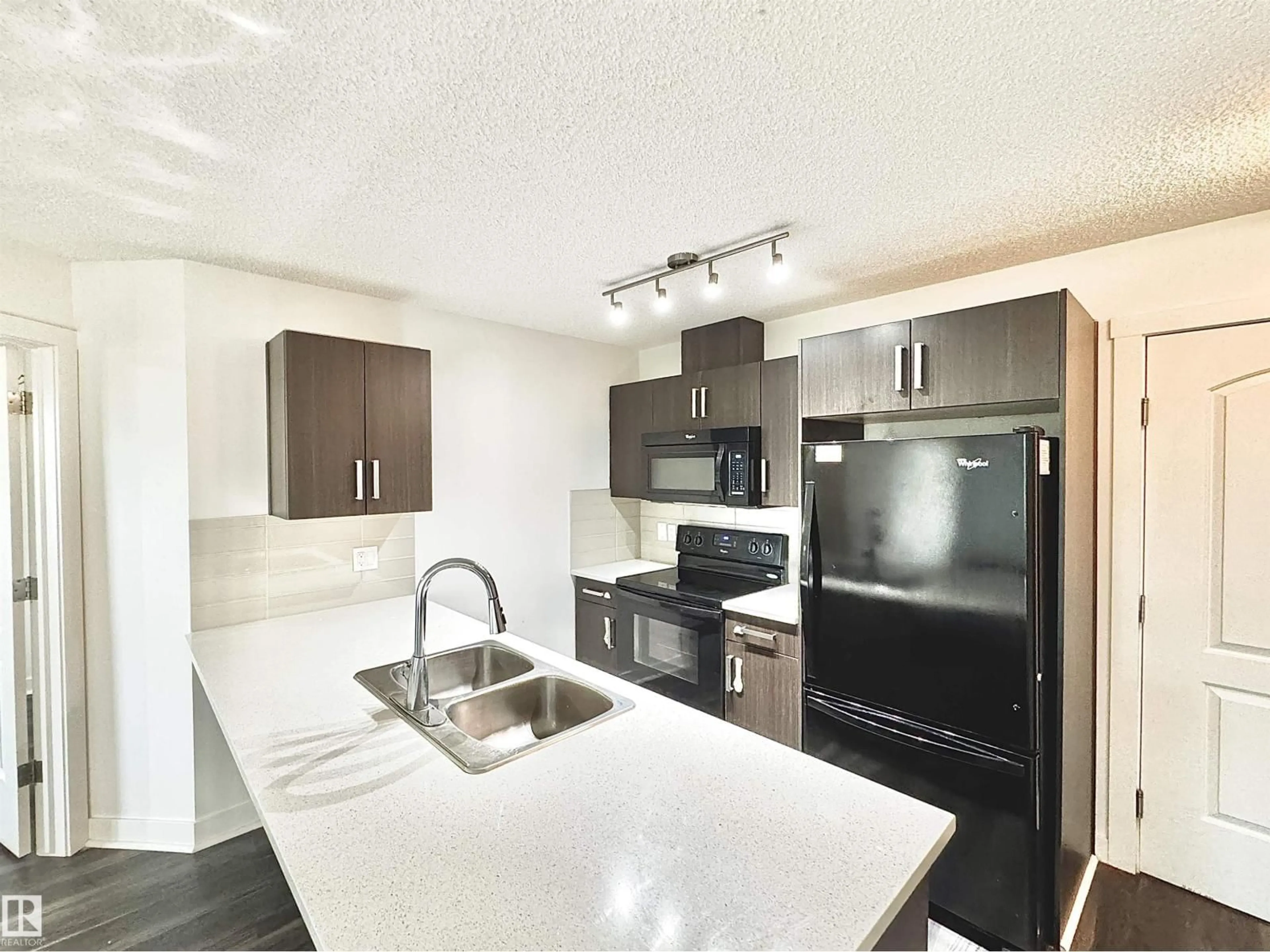 Open concept kitchen, unknown for 206 WATT BV, Edmonton Alberta T6X0Y2