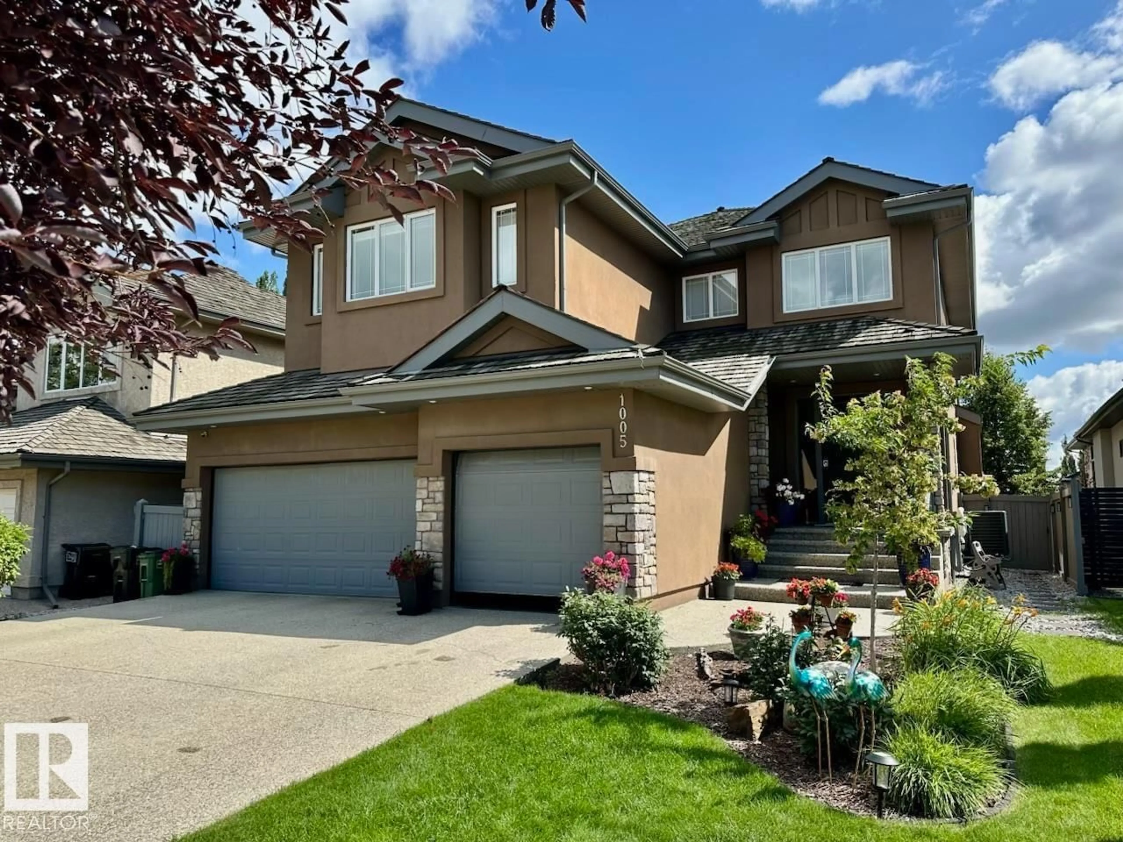 Home with vinyl exterior material, street for 1005 DOWNEY WY, Edmonton Alberta T6M2V4