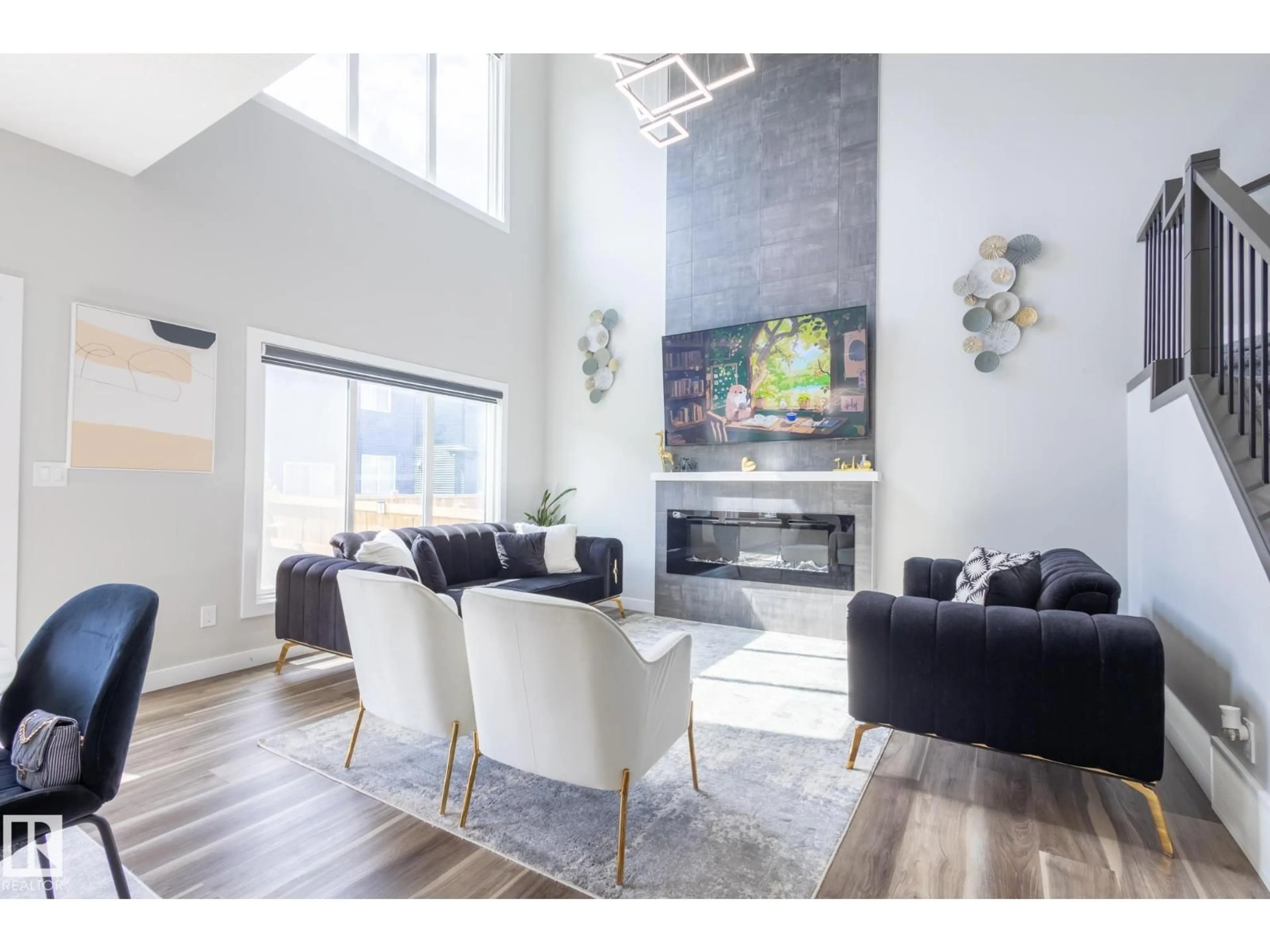 Living room with furniture, wood/laminate floor for 5745 KOOTOOK WY, Edmonton Alberta T6W4V9