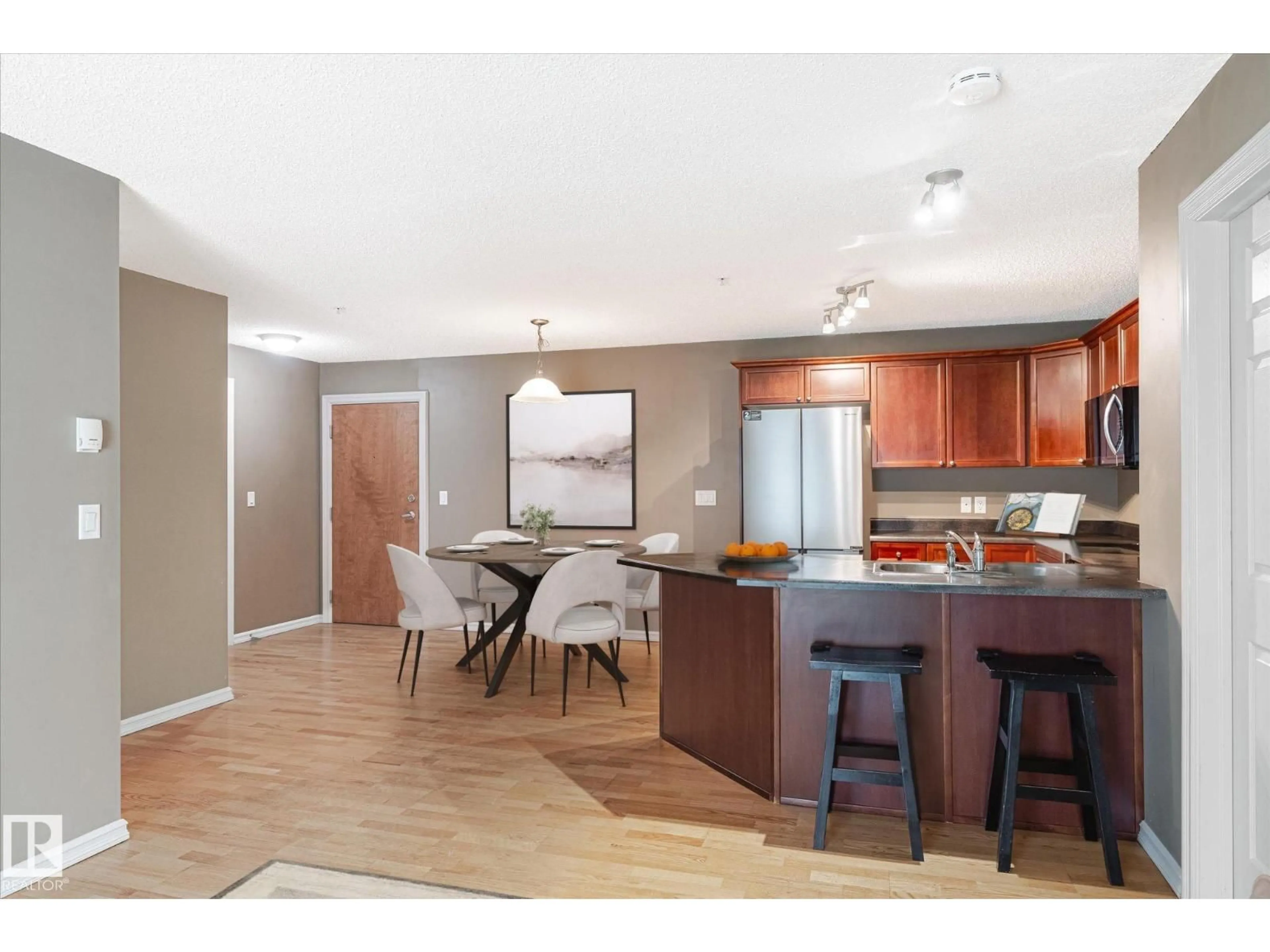 Open concept kitchen, wood/laminate floor for 13830 - 317 150 AV, Edmonton Alberta T6V1X2