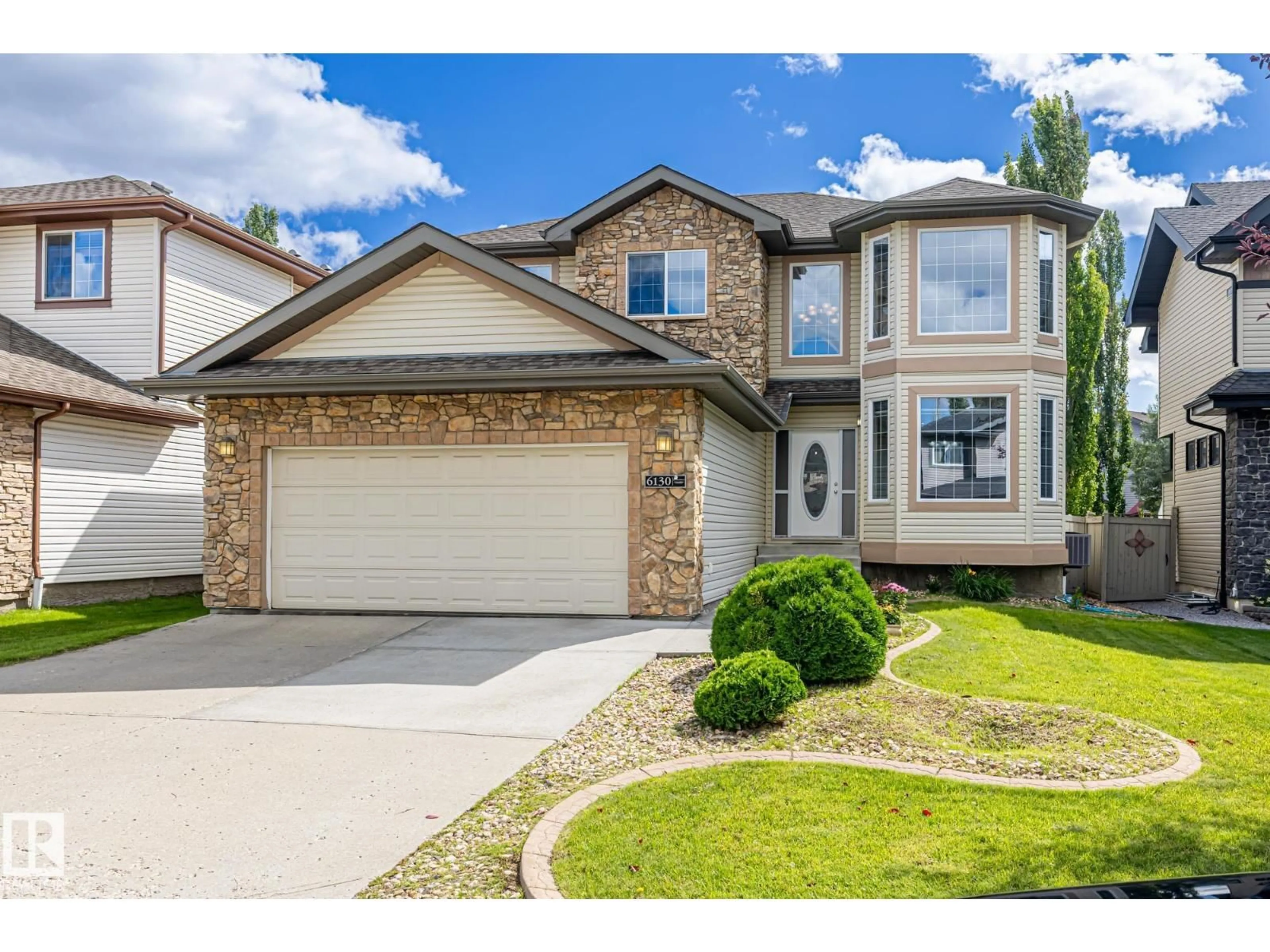 Home with vinyl exterior material, street for 6130 MAYNARD CR, Edmonton Alberta T6R0H8