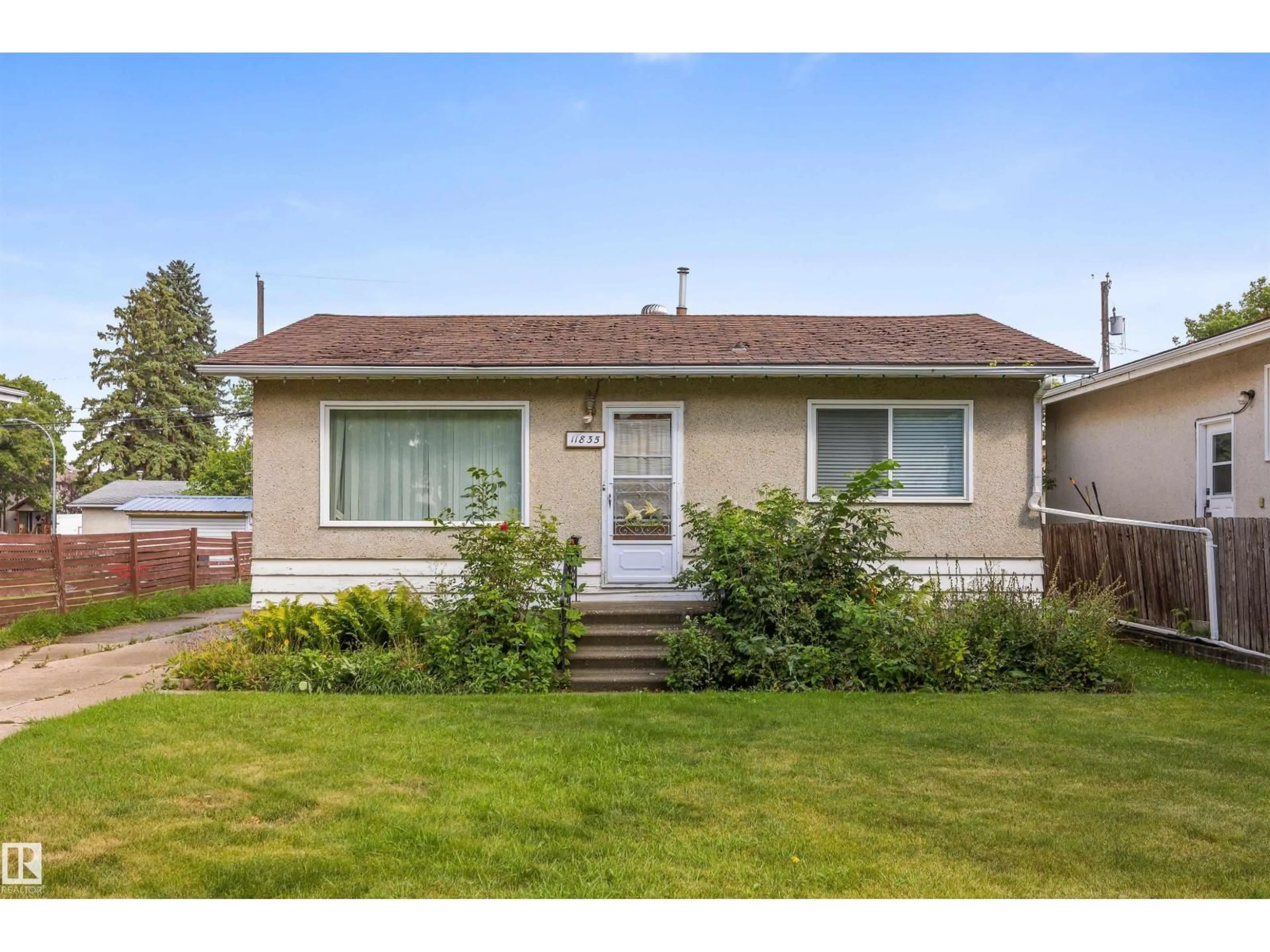 Home with vinyl exterior material, street for NW - 11835 45 ST, Edmonton Alberta T5W2T3