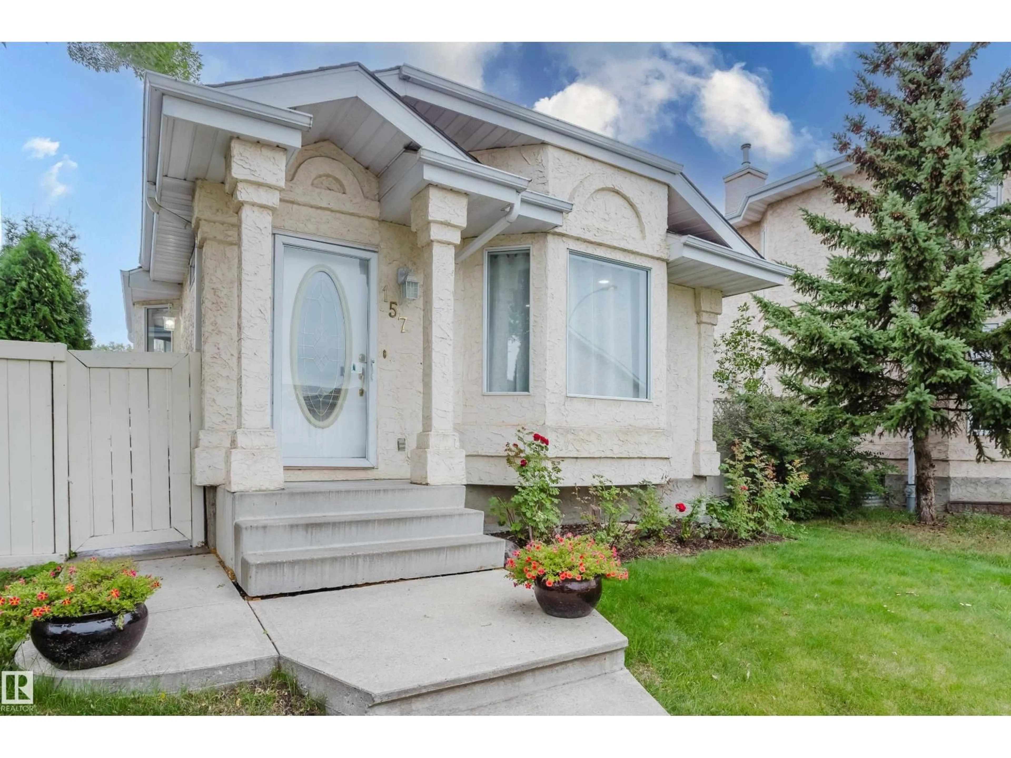 Home with vinyl exterior material, street for 157 RIVER POINT NW, Edmonton Alberta T5A4Y5