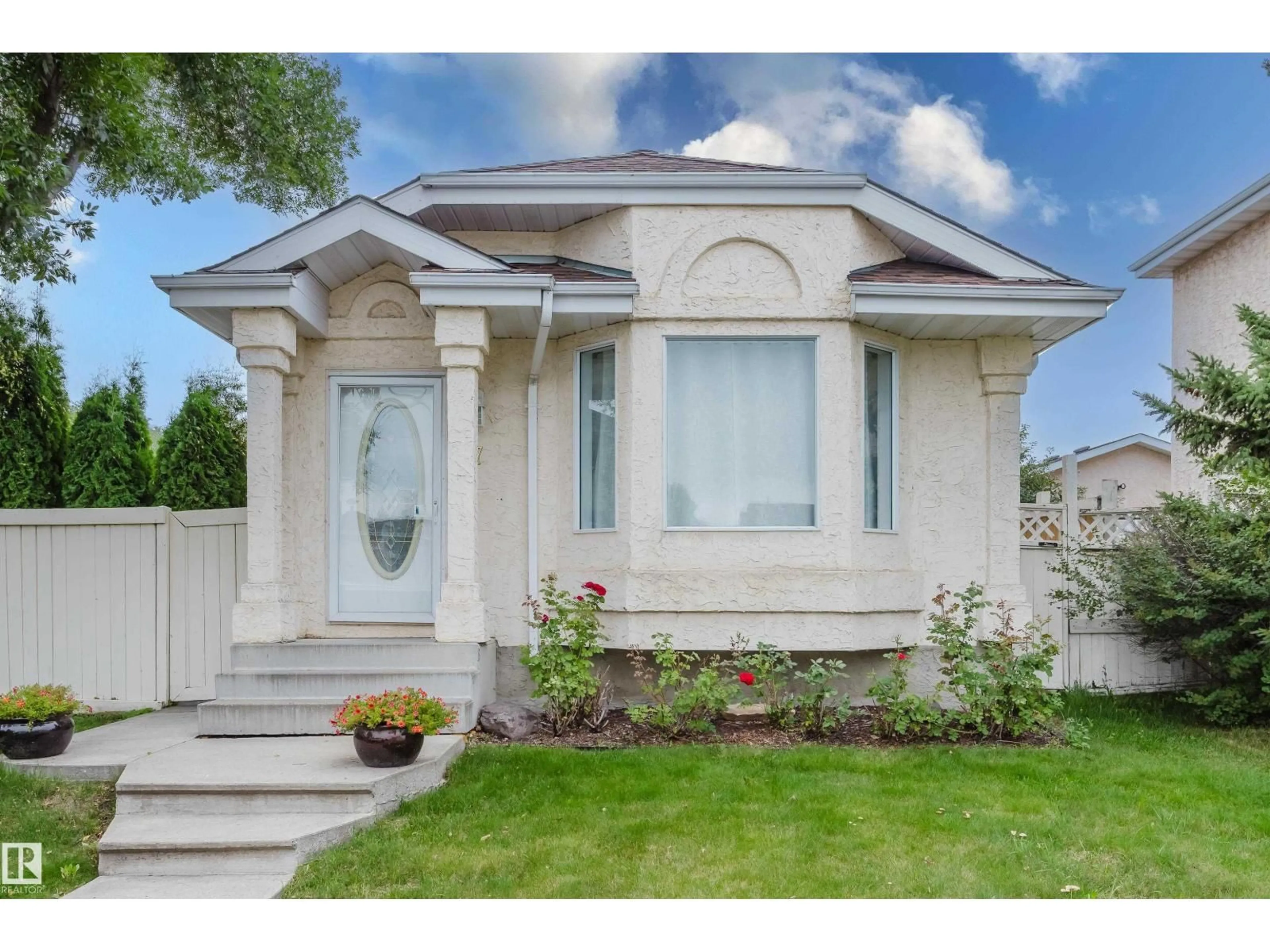 Home with vinyl exterior material, street for 157 RIVER POINT NW, Edmonton Alberta T5A4Y5