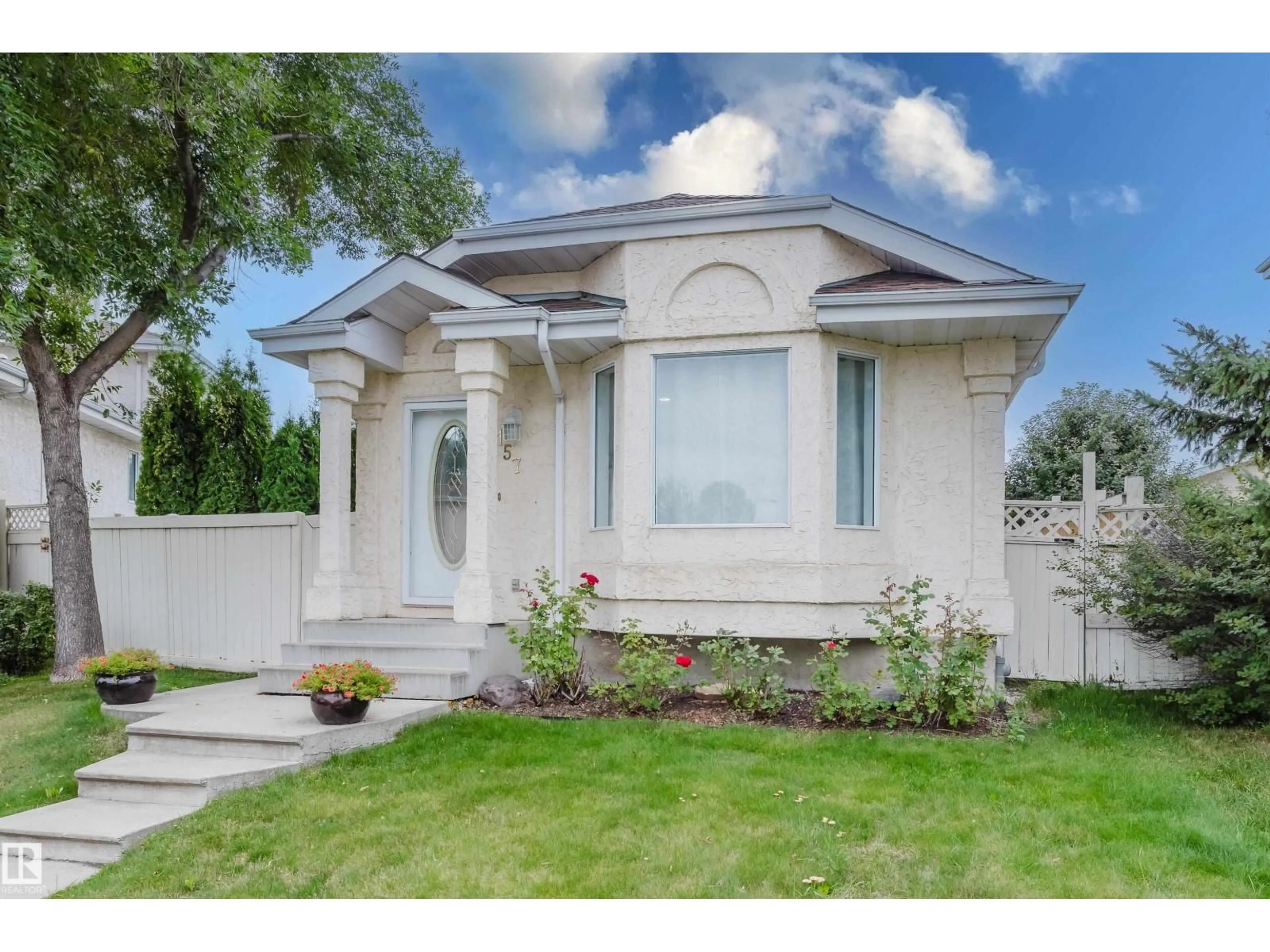 Home with vinyl exterior material, street for 157 RIVER POINT NW, Edmonton Alberta T5A4Y5