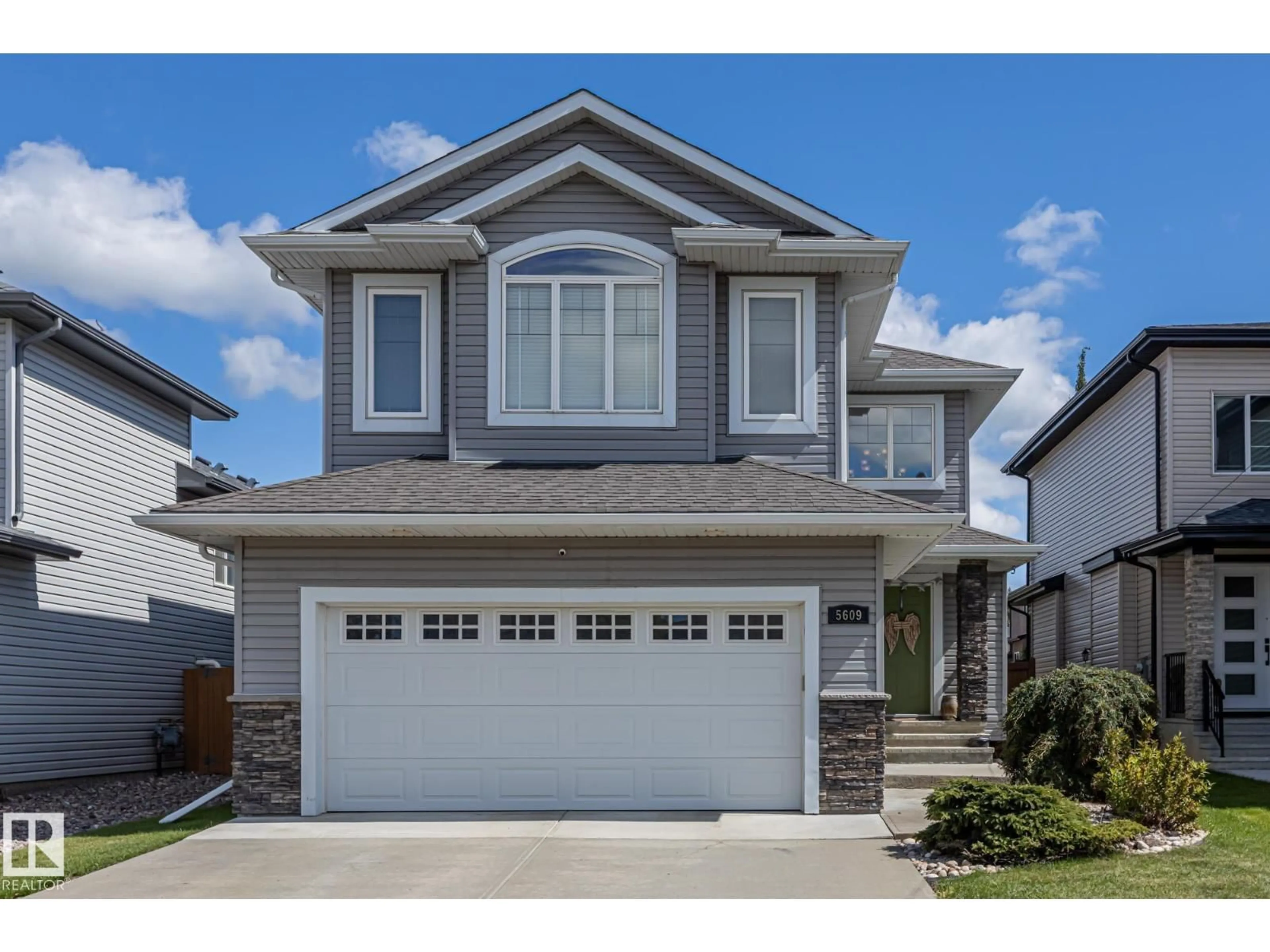 Home with vinyl exterior material, street for 5609 RUE EAGLEMONT, Beaumont Alberta T4X0G9