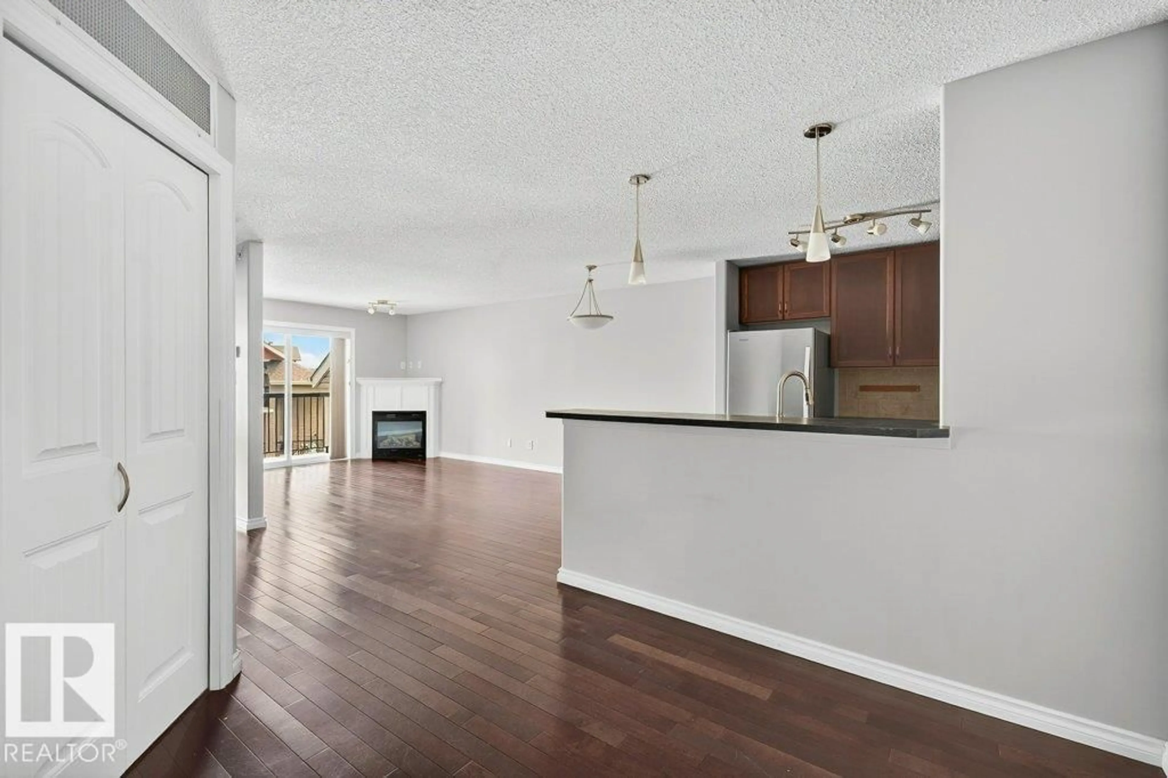 Open concept kitchen, wood/laminate floor for 321 17415 99 AV, Edmonton Alberta T5T0W8