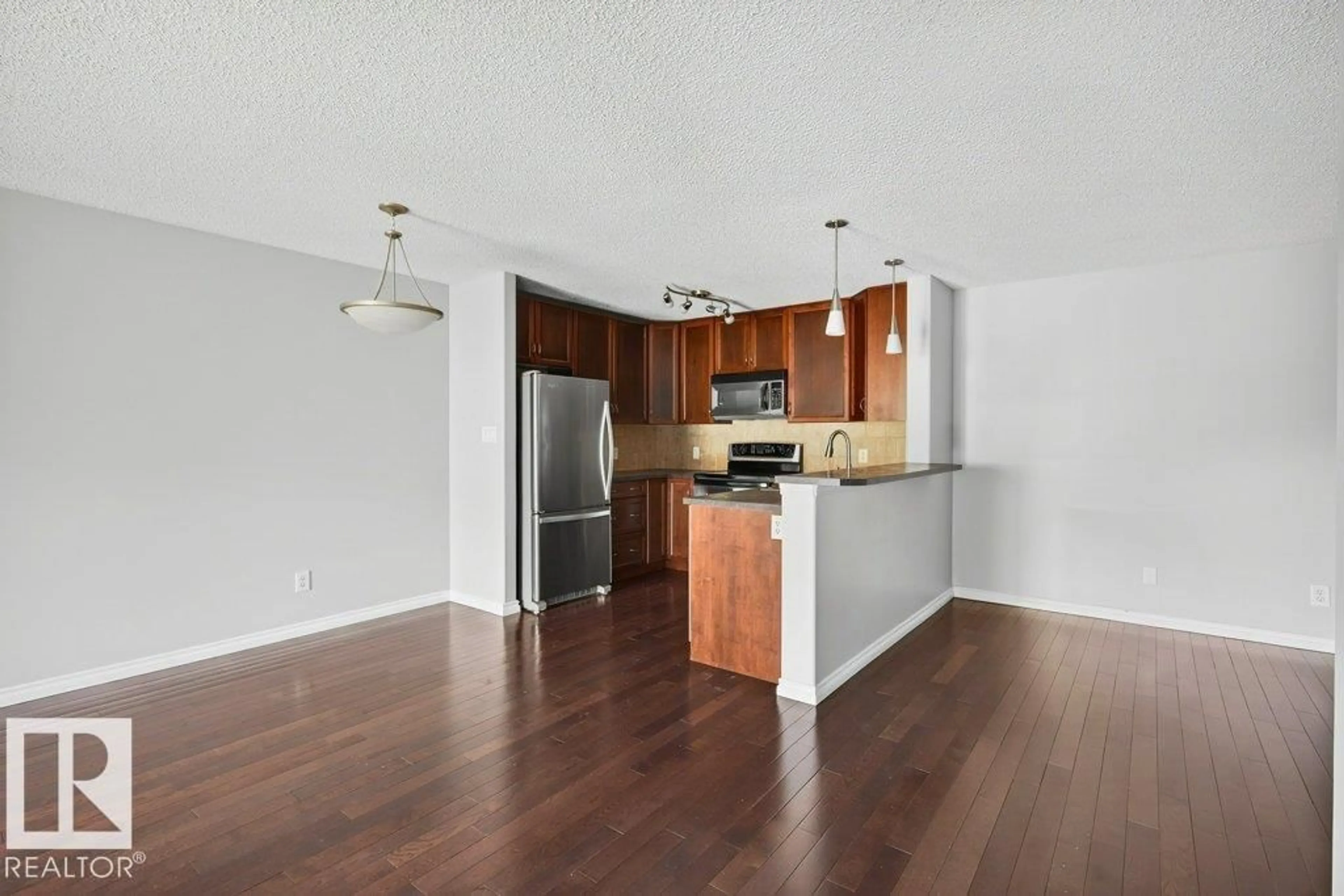 Open concept kitchen, wood/laminate floor for 321 17415 99 AV, Edmonton Alberta T5T0W8