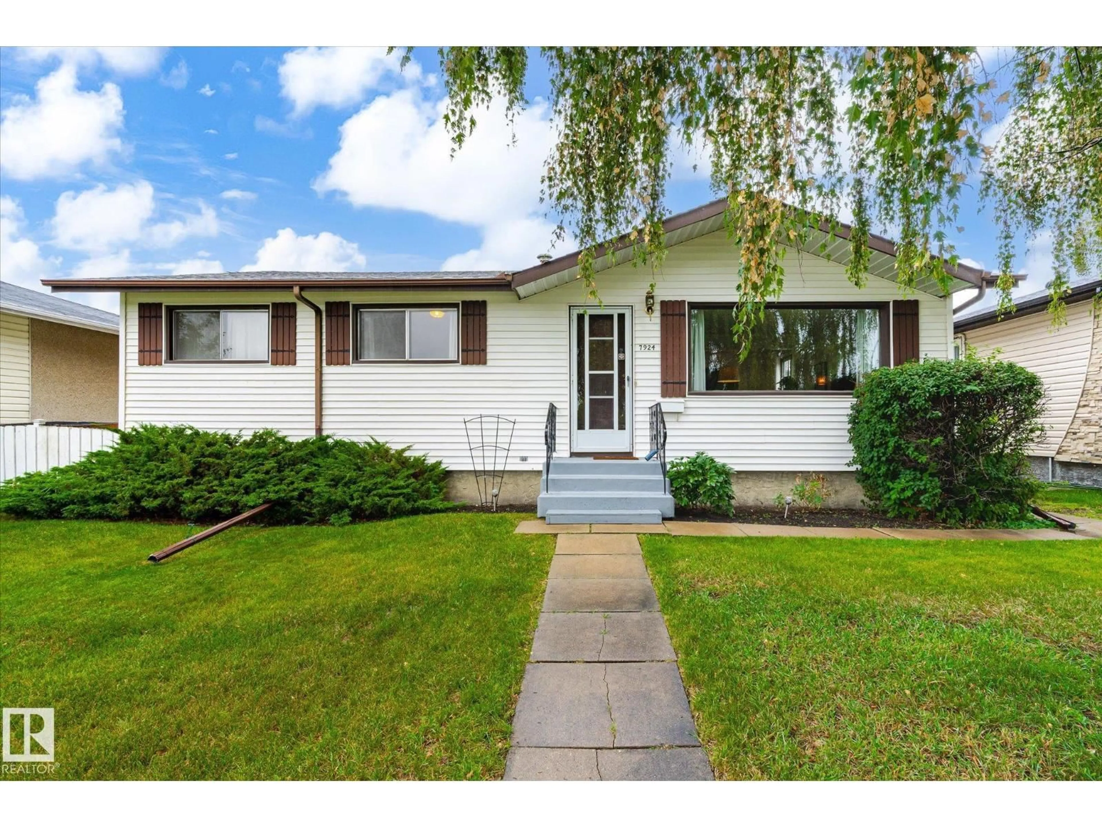 Home with vinyl exterior material, street for 7924 130 AV, Edmonton Alberta T5C1Y5