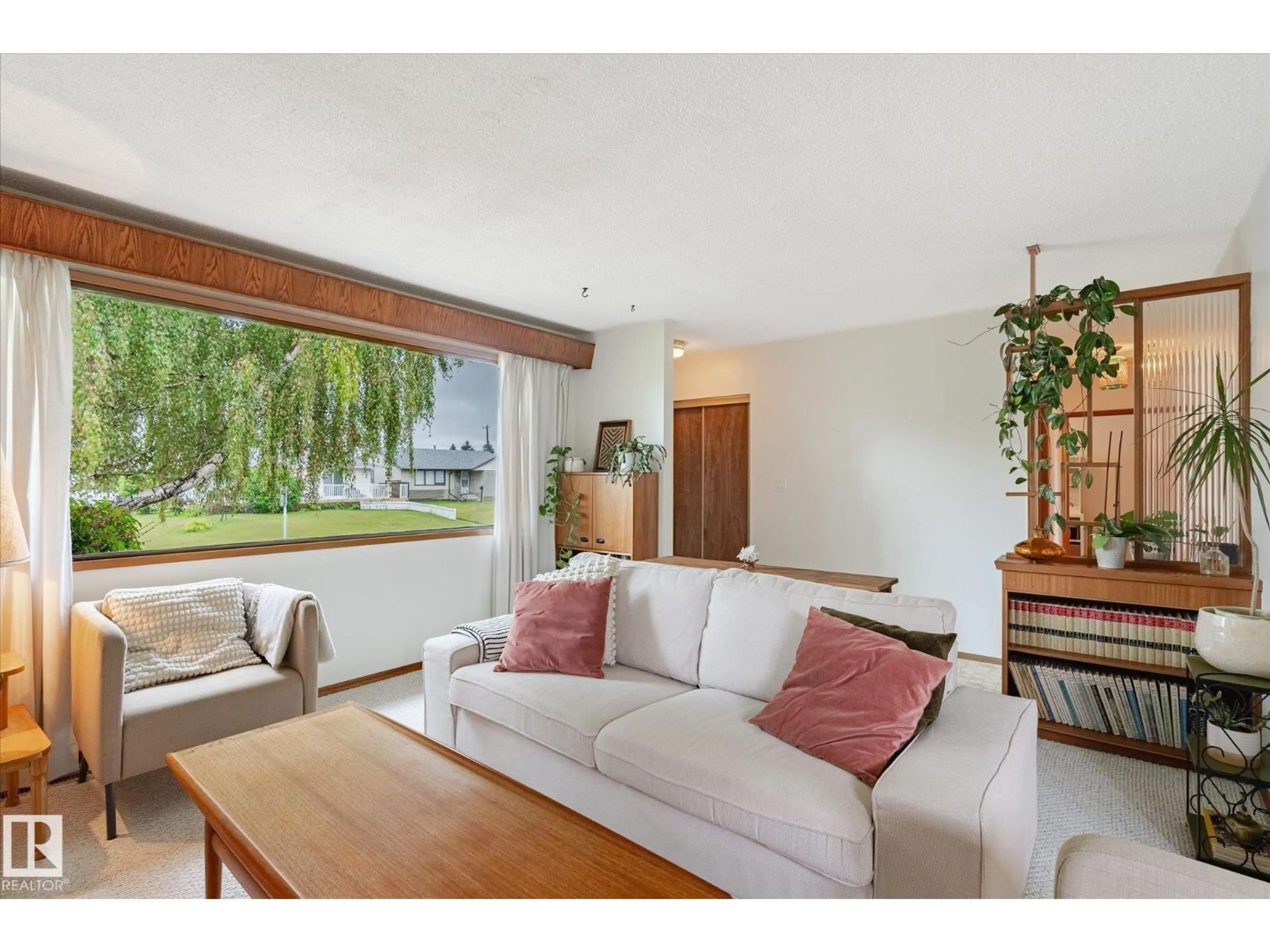Living room with furniture, wood/laminate floor for 7924 130 AV, Edmonton Alberta T5C1Y5