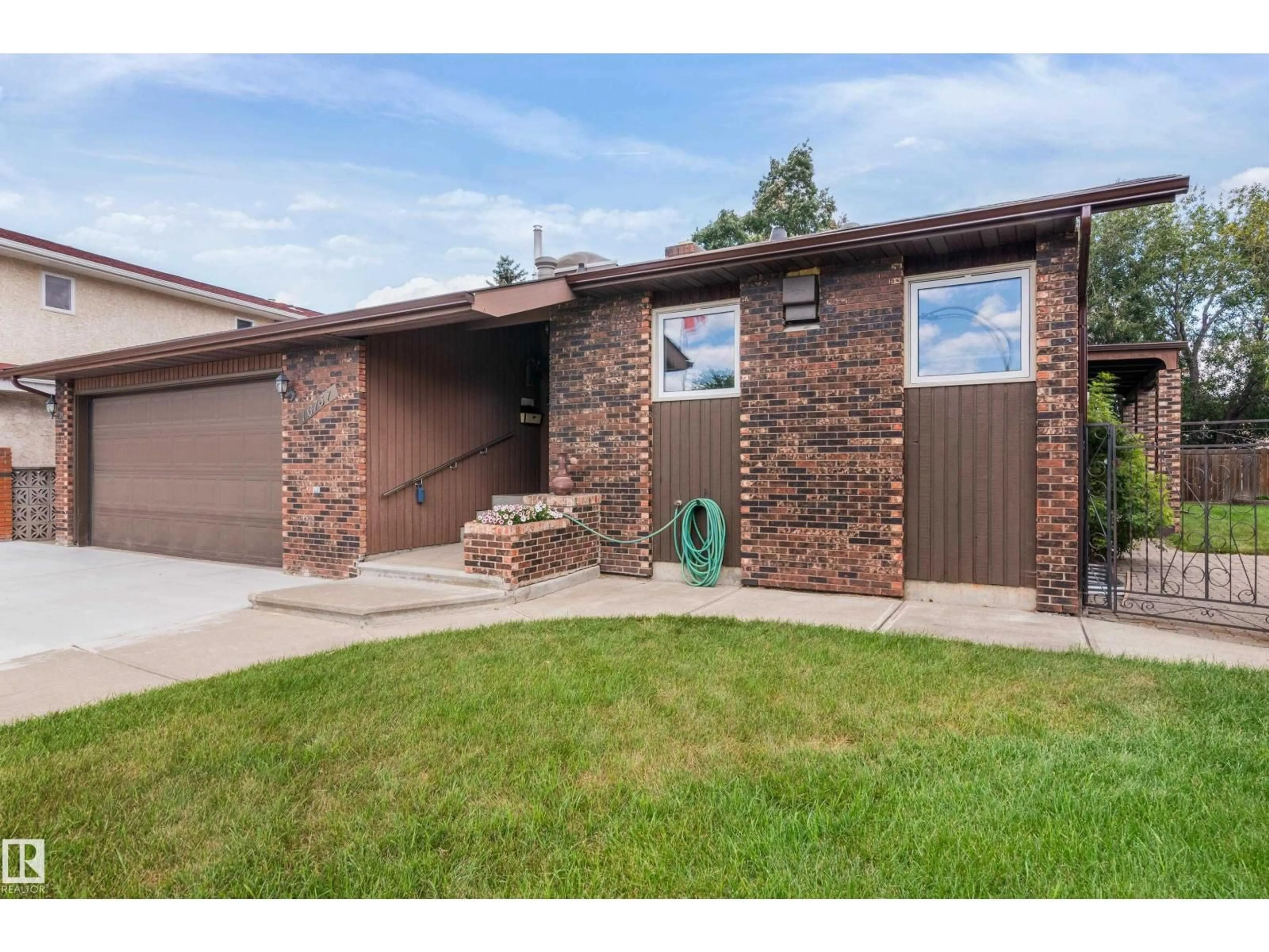 Home with brick exterior material, street for 16737 110 ST, Edmonton Alberta T5X2T9