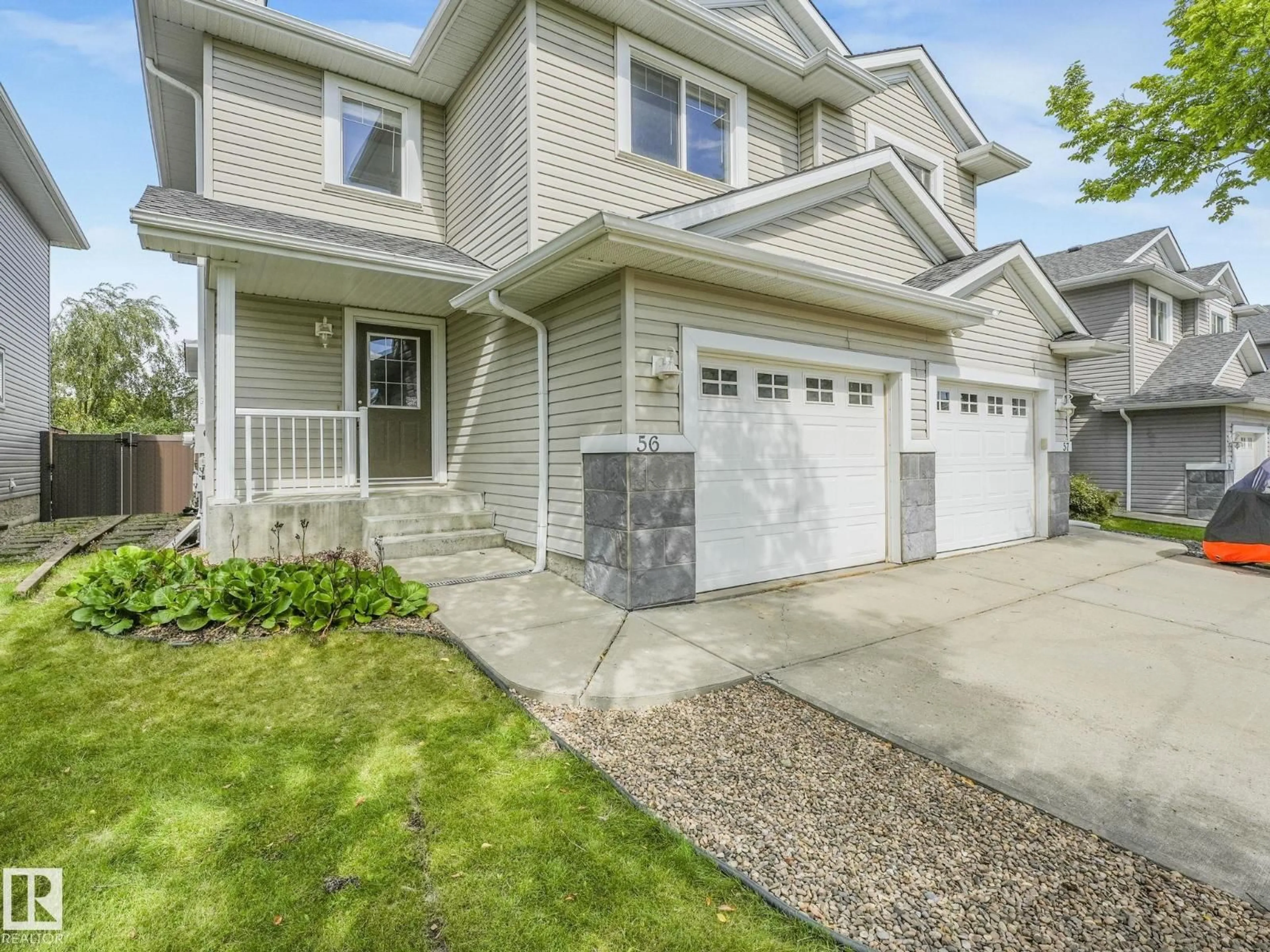 Home with vinyl exterior material, street for #56 - 1428 HODGSON WY, Edmonton Alberta T6R3P8