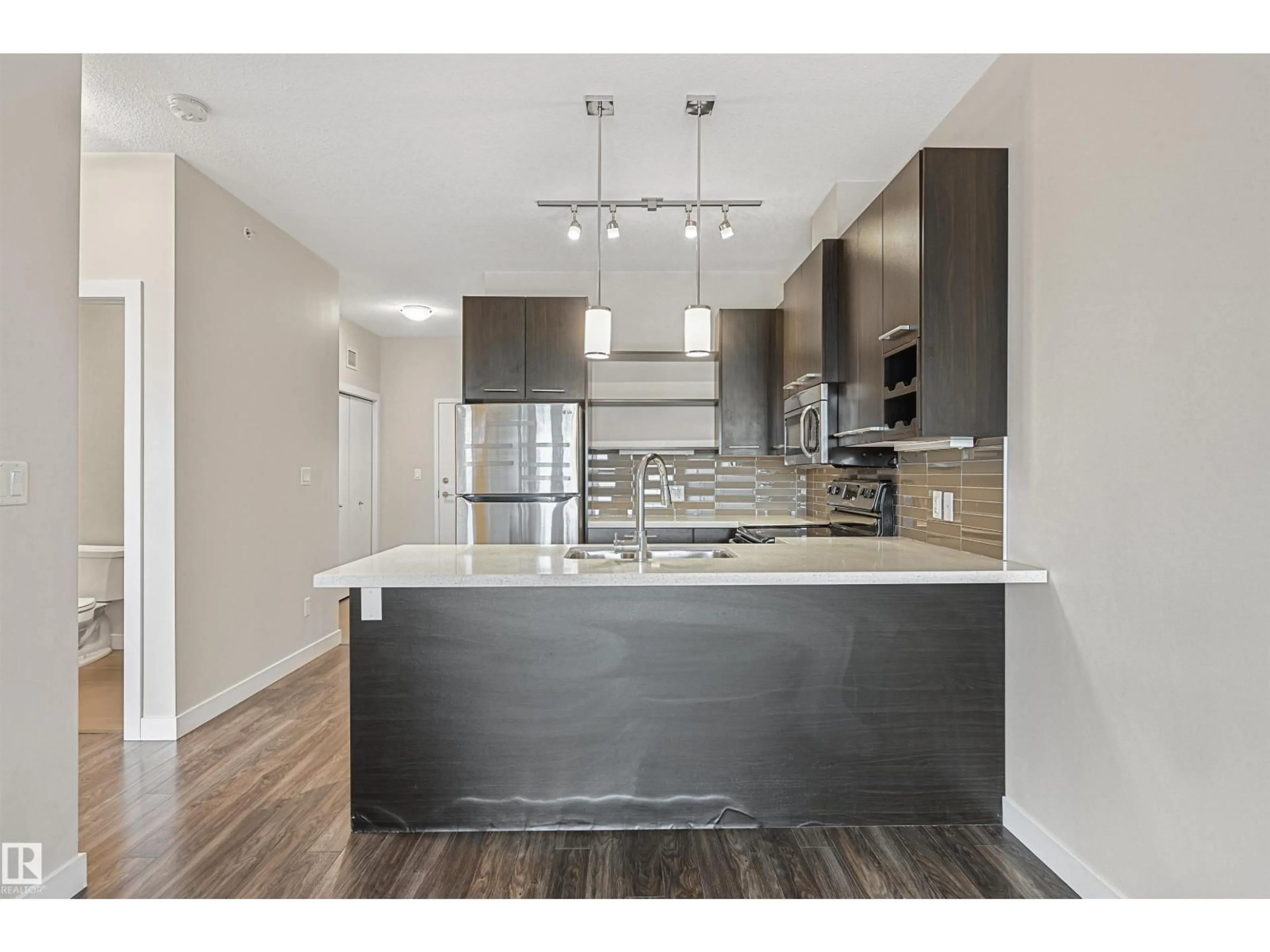 Open concept kitchen, wood/laminate floor for 403 - 10418 81 AV, Edmonton Alberta T6E1X5
