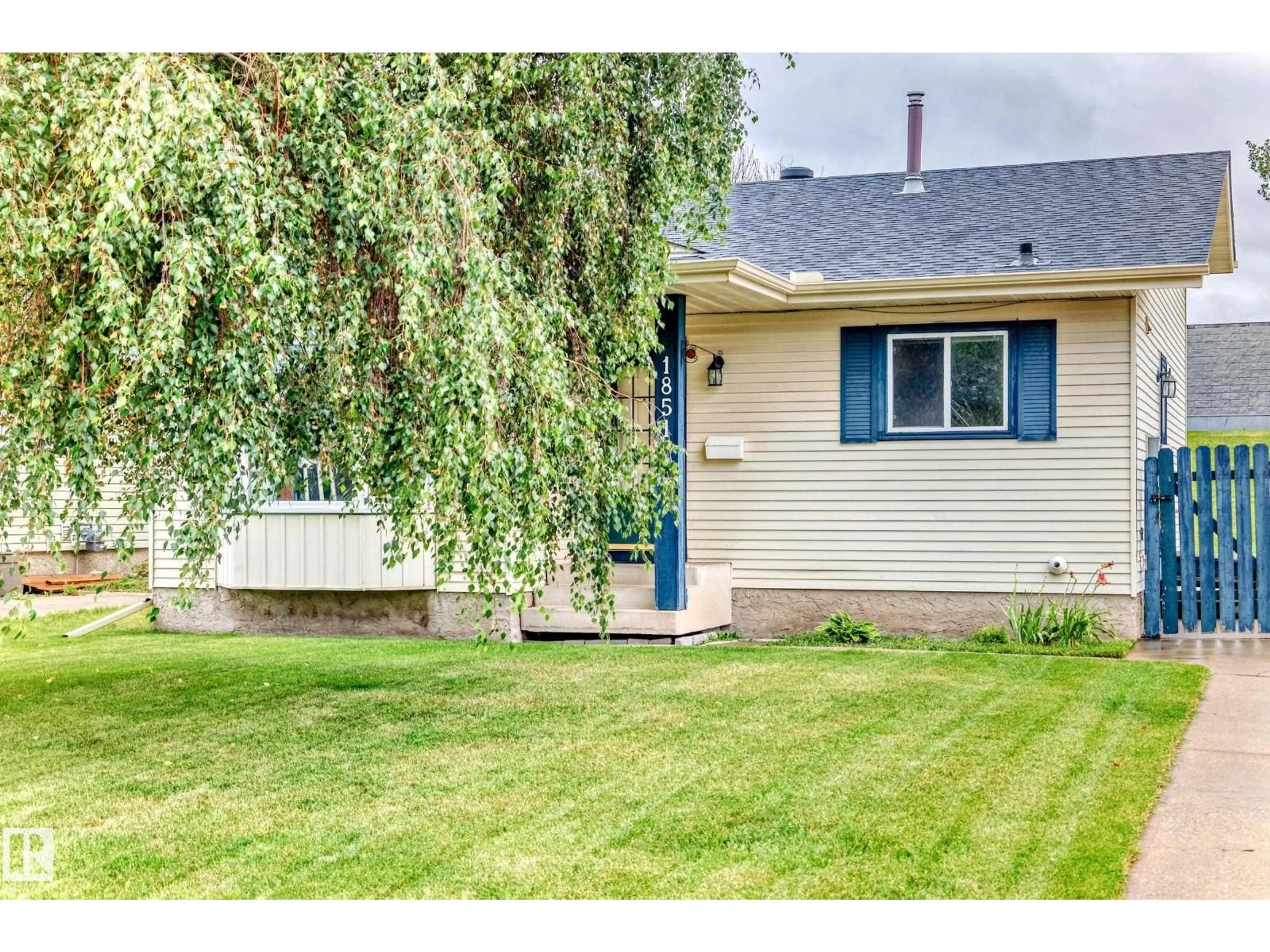 Home with vinyl exterior material, street for NW - 1851 104 ST, Edmonton Alberta T6J5J9
