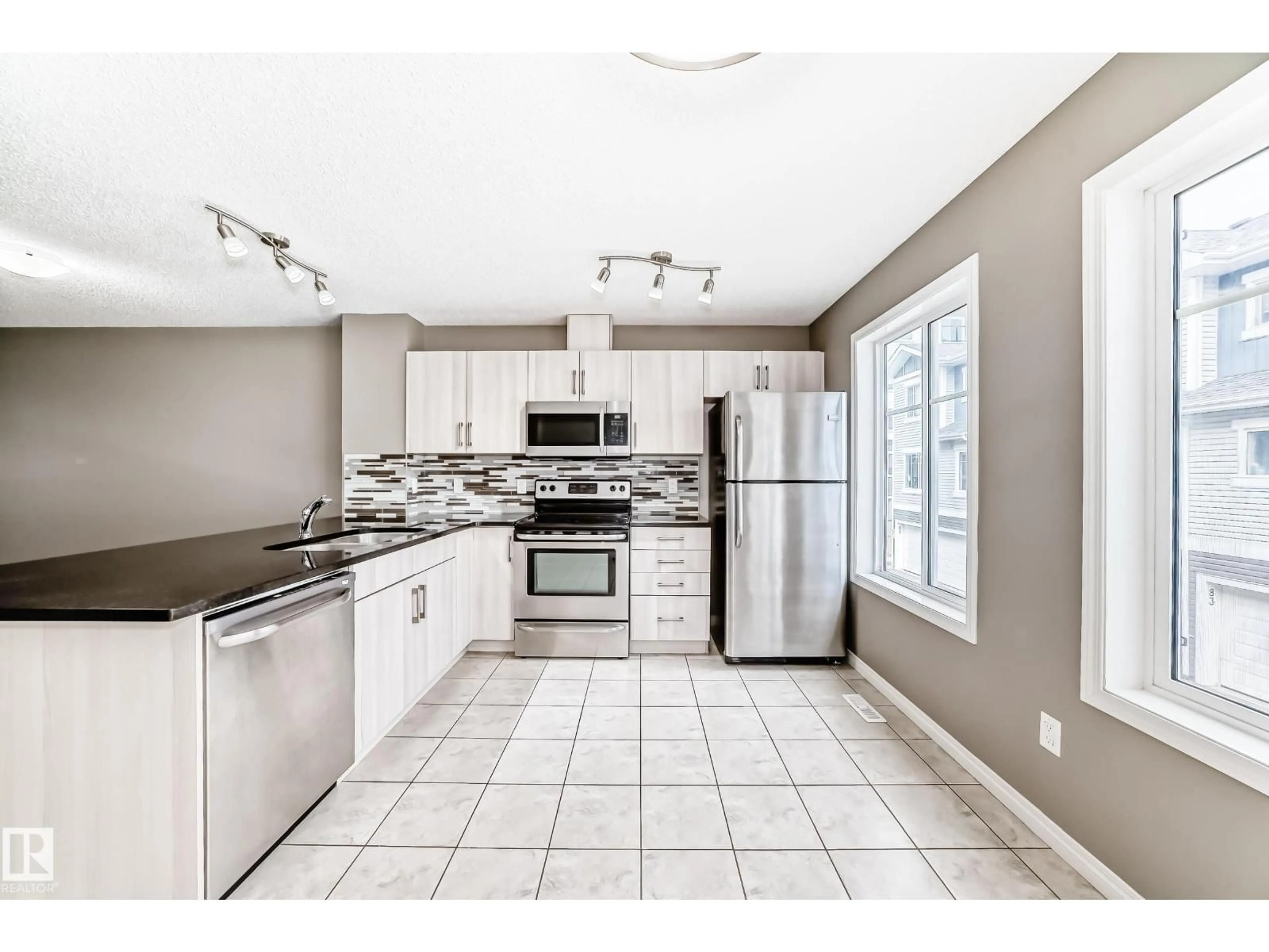 Open concept kitchen, ceramic/tile floor for #89 - 2905 141 ST, Edmonton Alberta T6W3M4