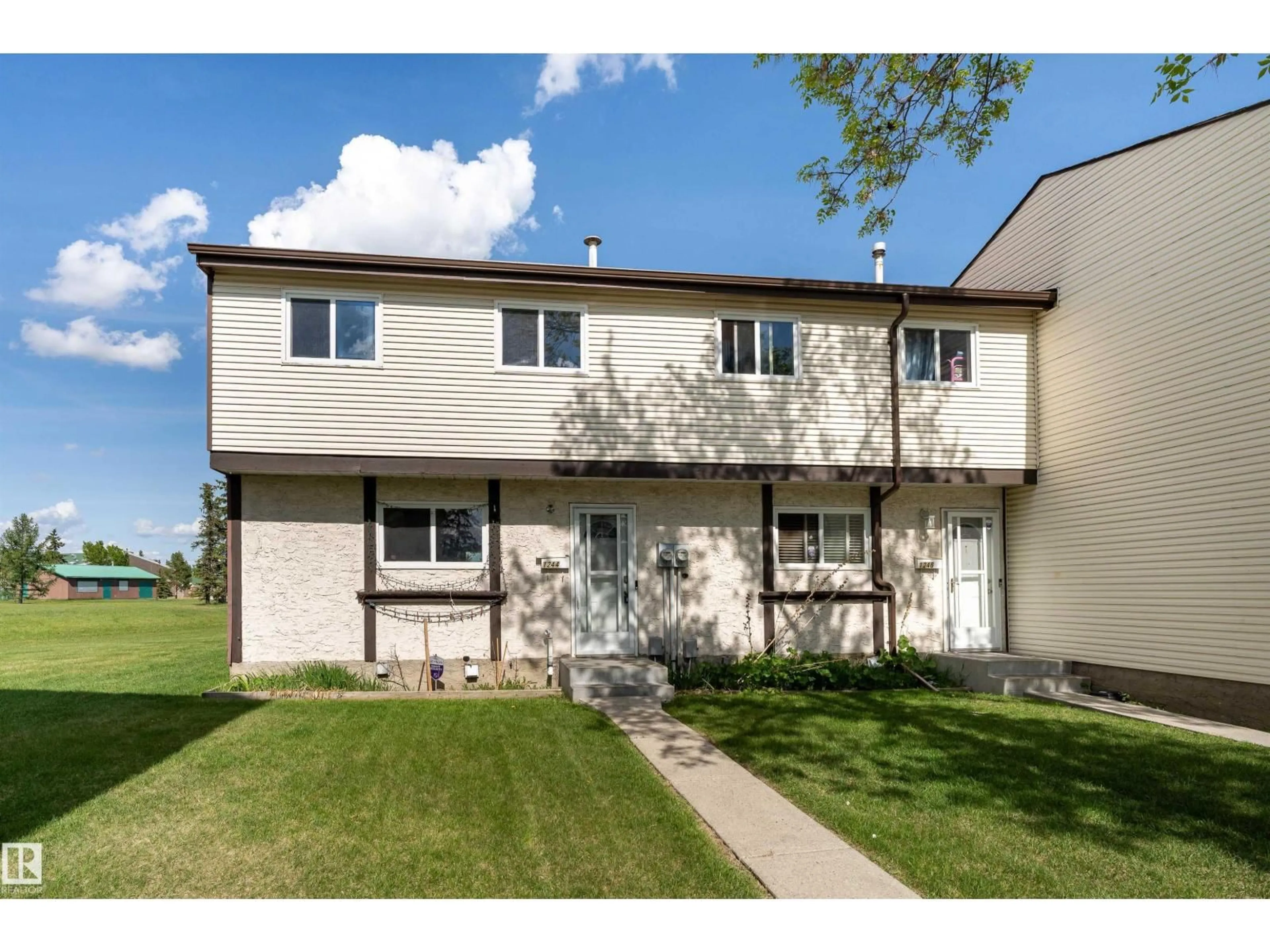 Home with vinyl exterior material, street for 1244 LAKEWOOD RD, Edmonton Alberta T6K3P2