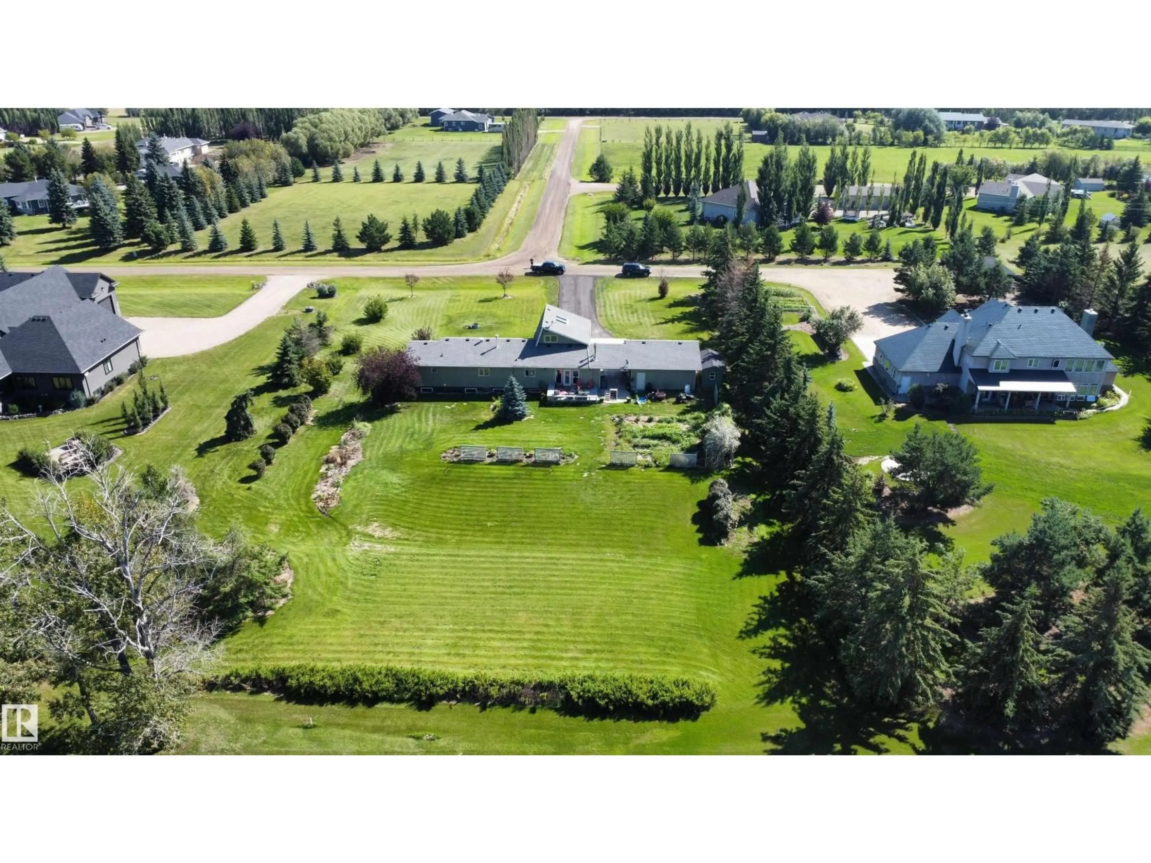 A pic from outside/outdoor area/front of a property/back of a property/a pic from drone, unknown for 26 - 27118 HWY 18, Rural Westlock County Alberta T7P2P5