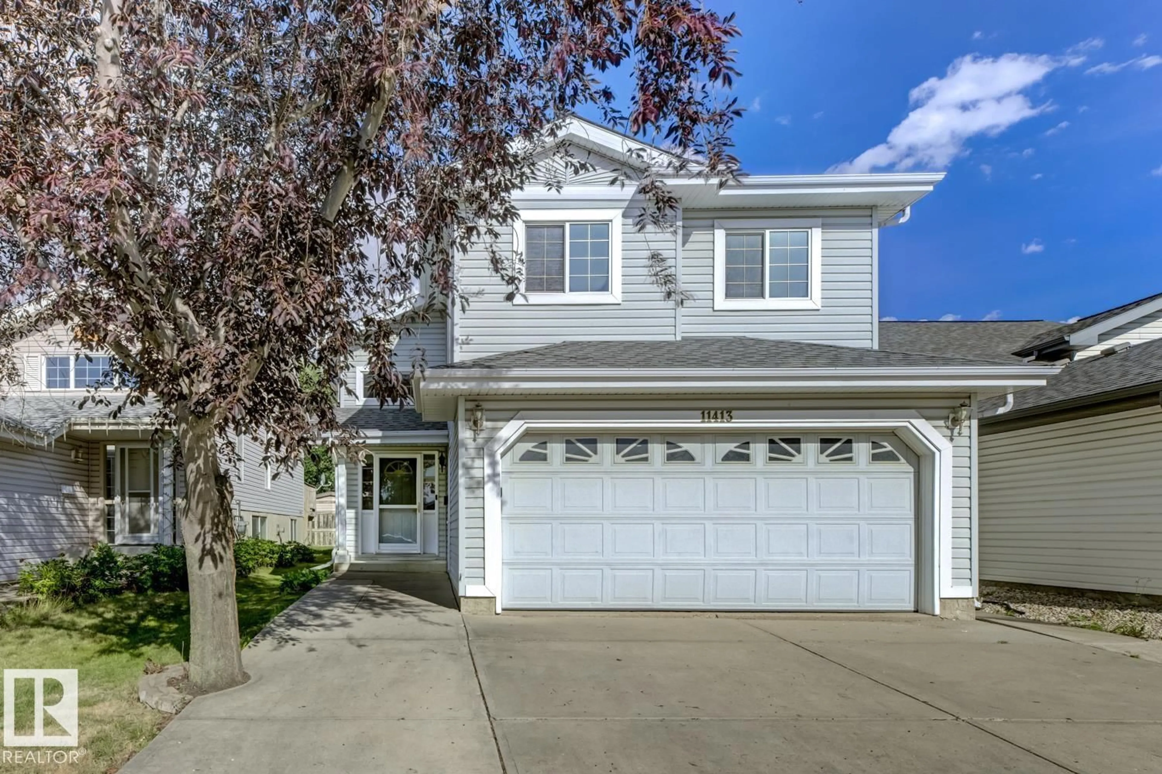 Home with vinyl exterior material, street for 11413 118A ST NW, Edmonton Alberta T5G3J2