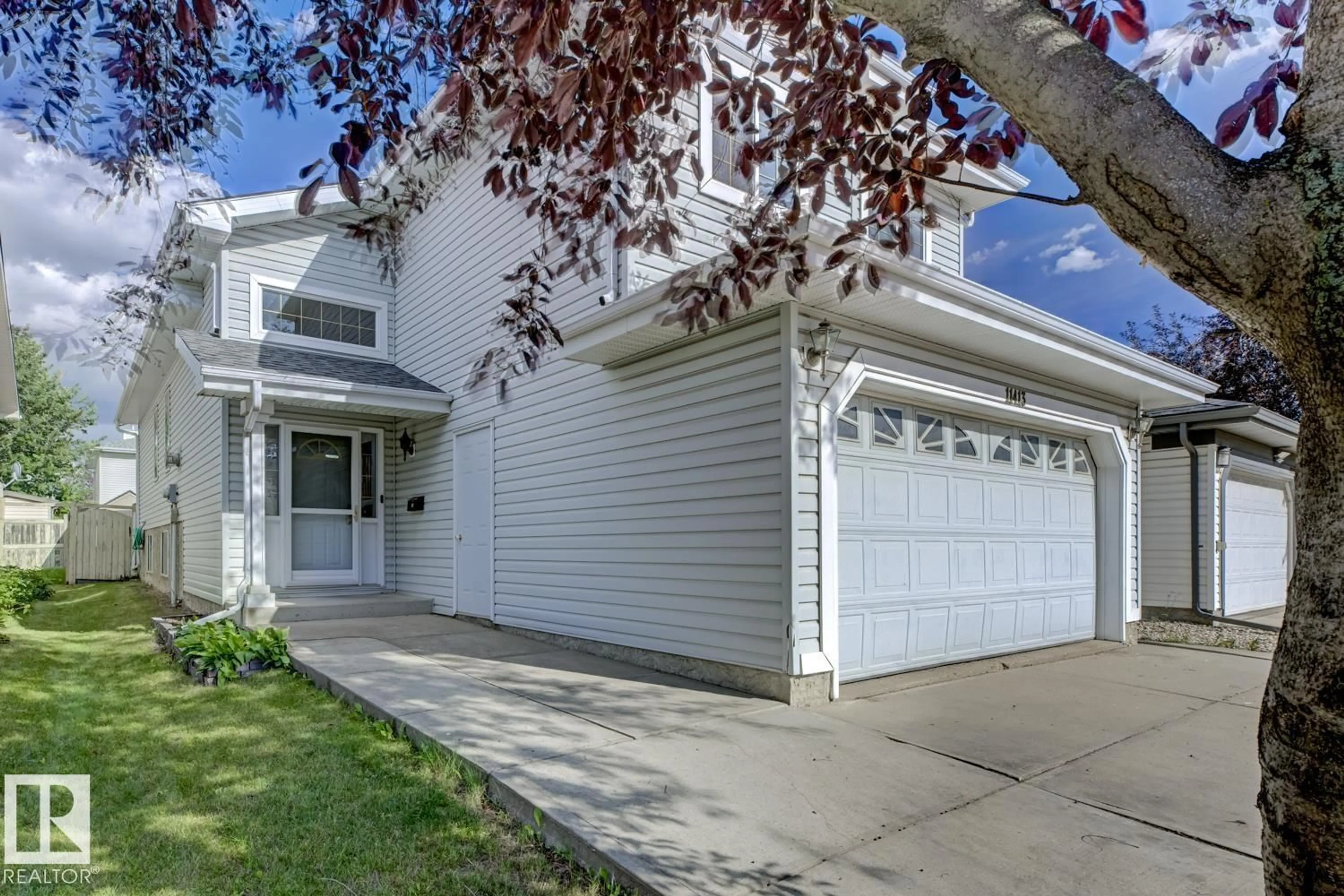 Home with vinyl exterior material, street for 11413 118A ST NW, Edmonton Alberta T5G3J2