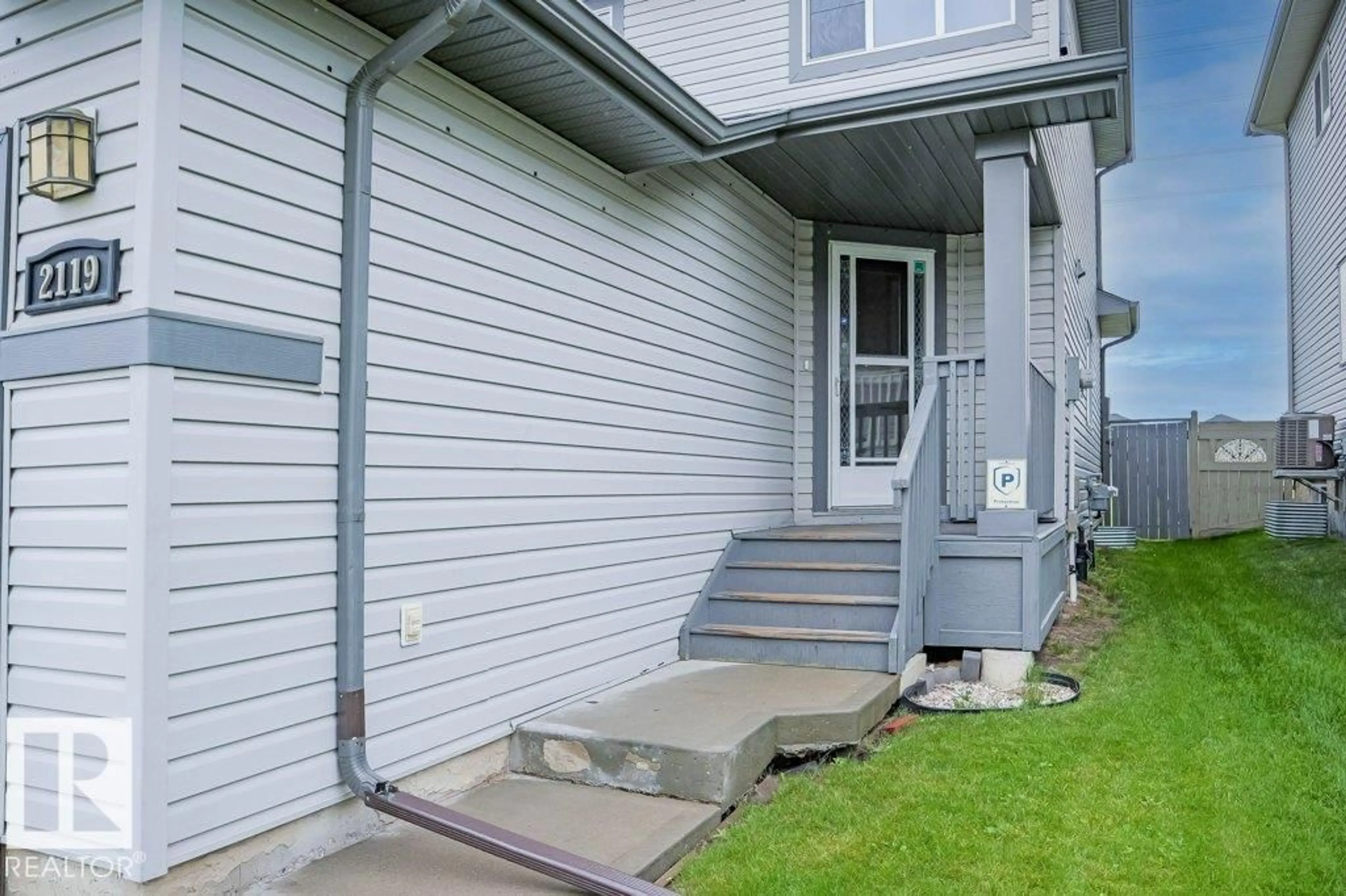 Home with vinyl exterior material, street for 2119 28 ST, Edmonton Alberta T6T0K2