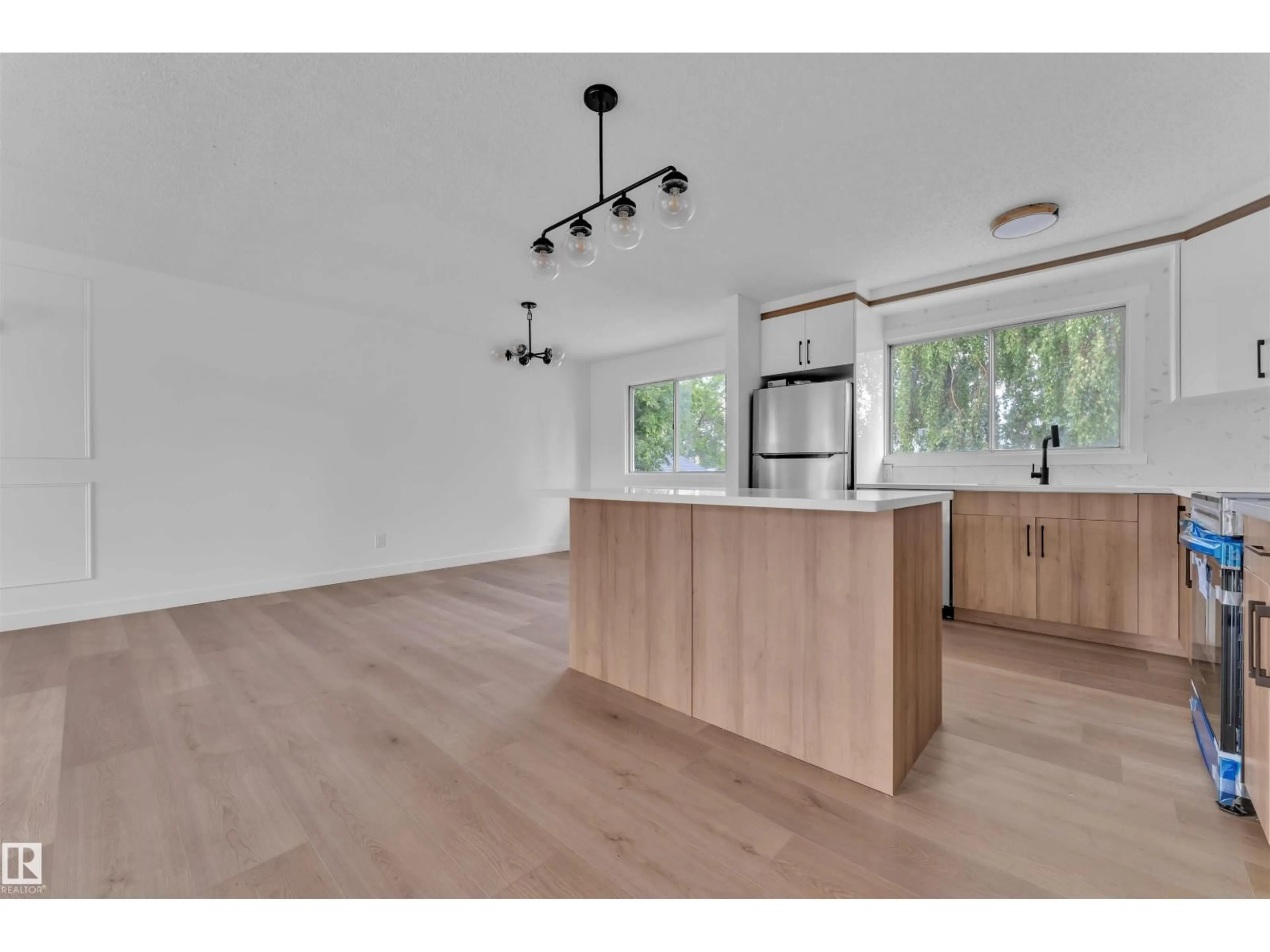 Open concept kitchen, wood/laminate floor for 132 RICHFIELD RD, Edmonton Alberta T6K0A2