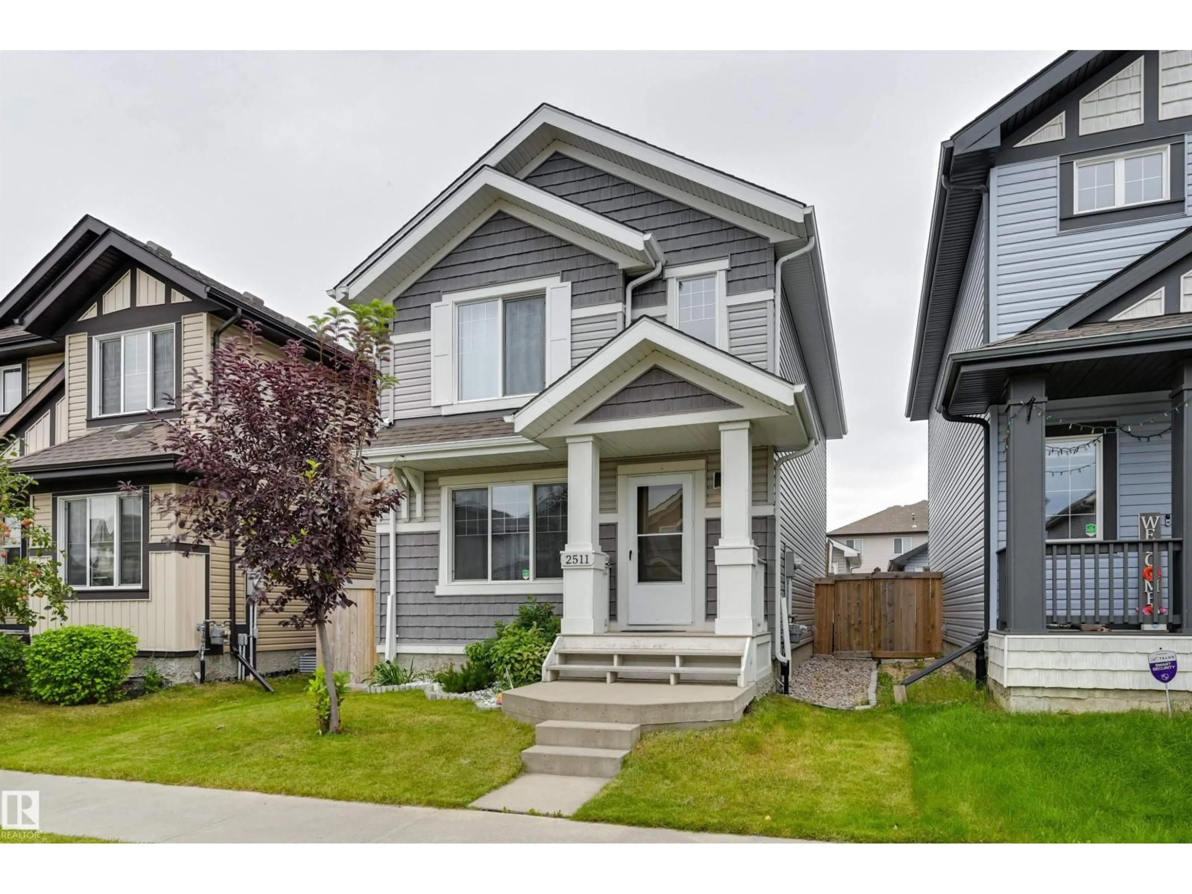 Home with vinyl exterior material, street for 2511 20 AV, Edmonton Alberta T6T0Y7