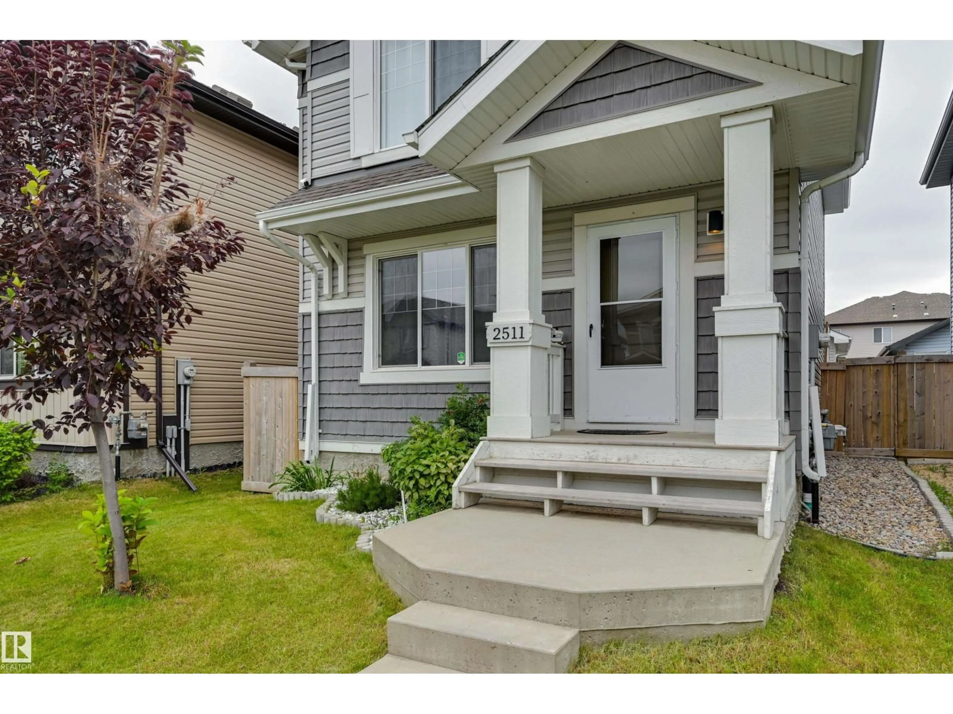 Home with vinyl exterior material, street for 2511 20 AV, Edmonton Alberta T6T0Y7