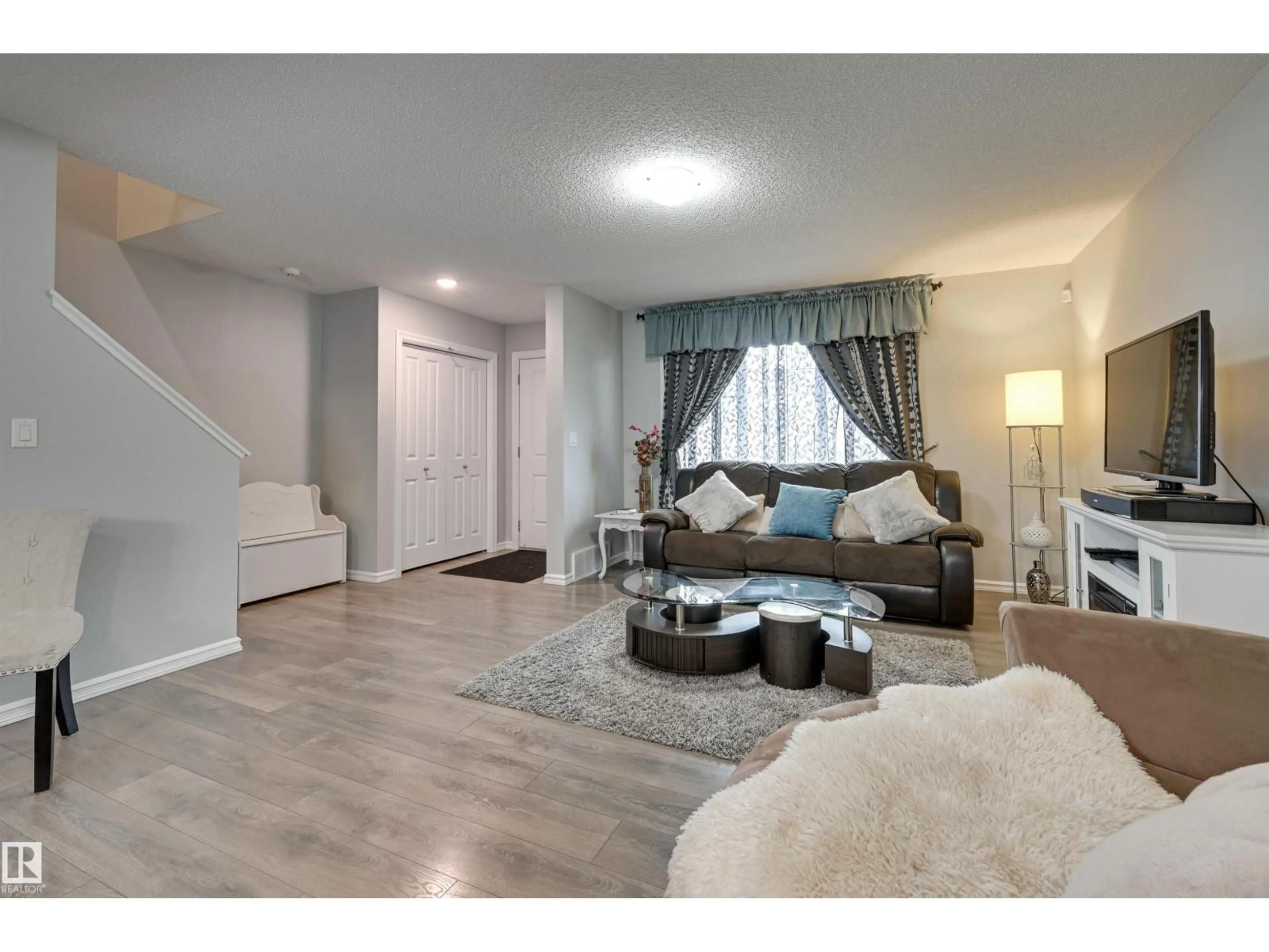 Living room with furniture, unknown for 2511 20 AV, Edmonton Alberta T6T0Y7