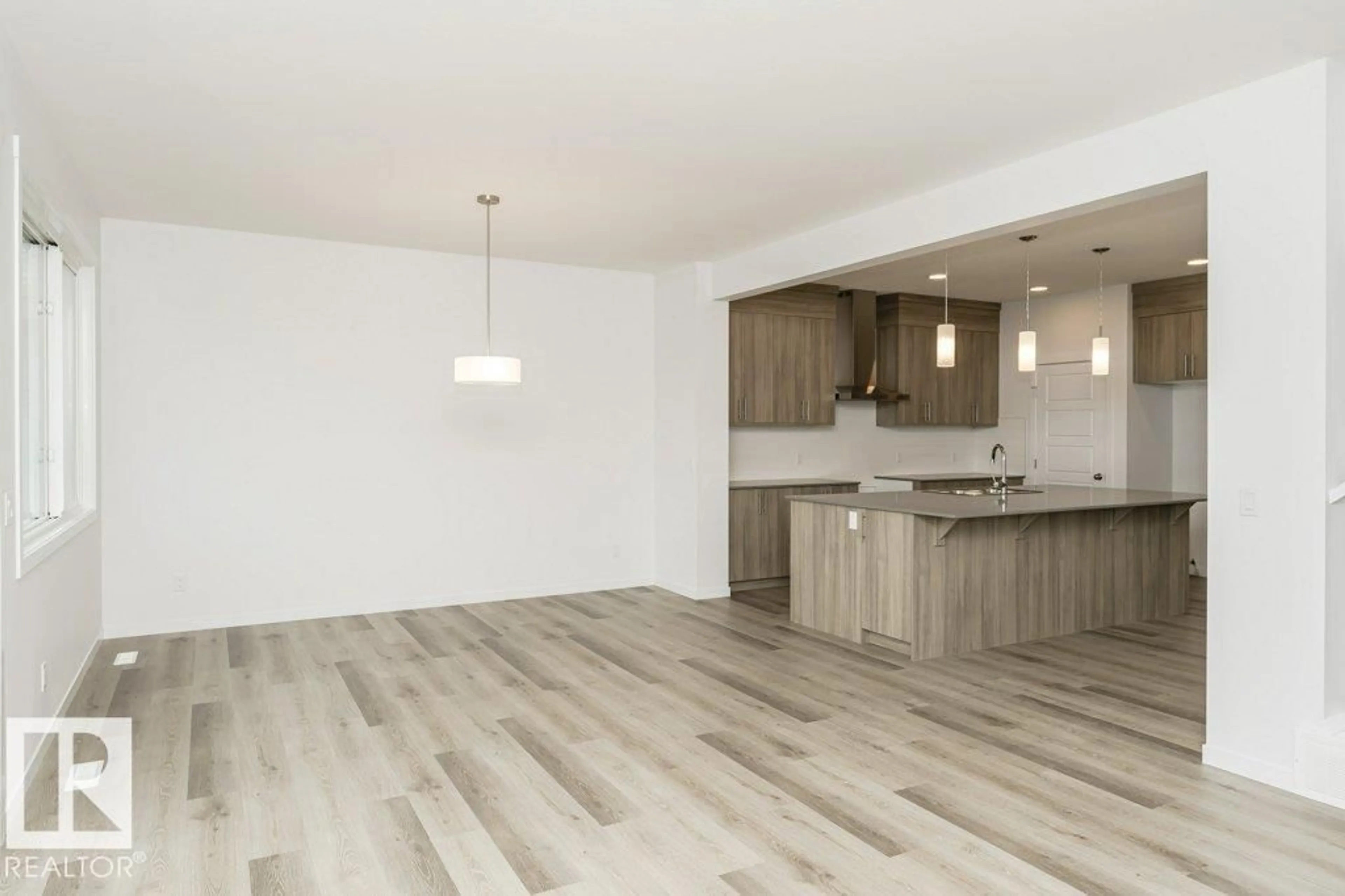 Open concept kitchen, wood/laminate floor for 3947 WREN LO NW, Edmonton Alberta T5S0T1