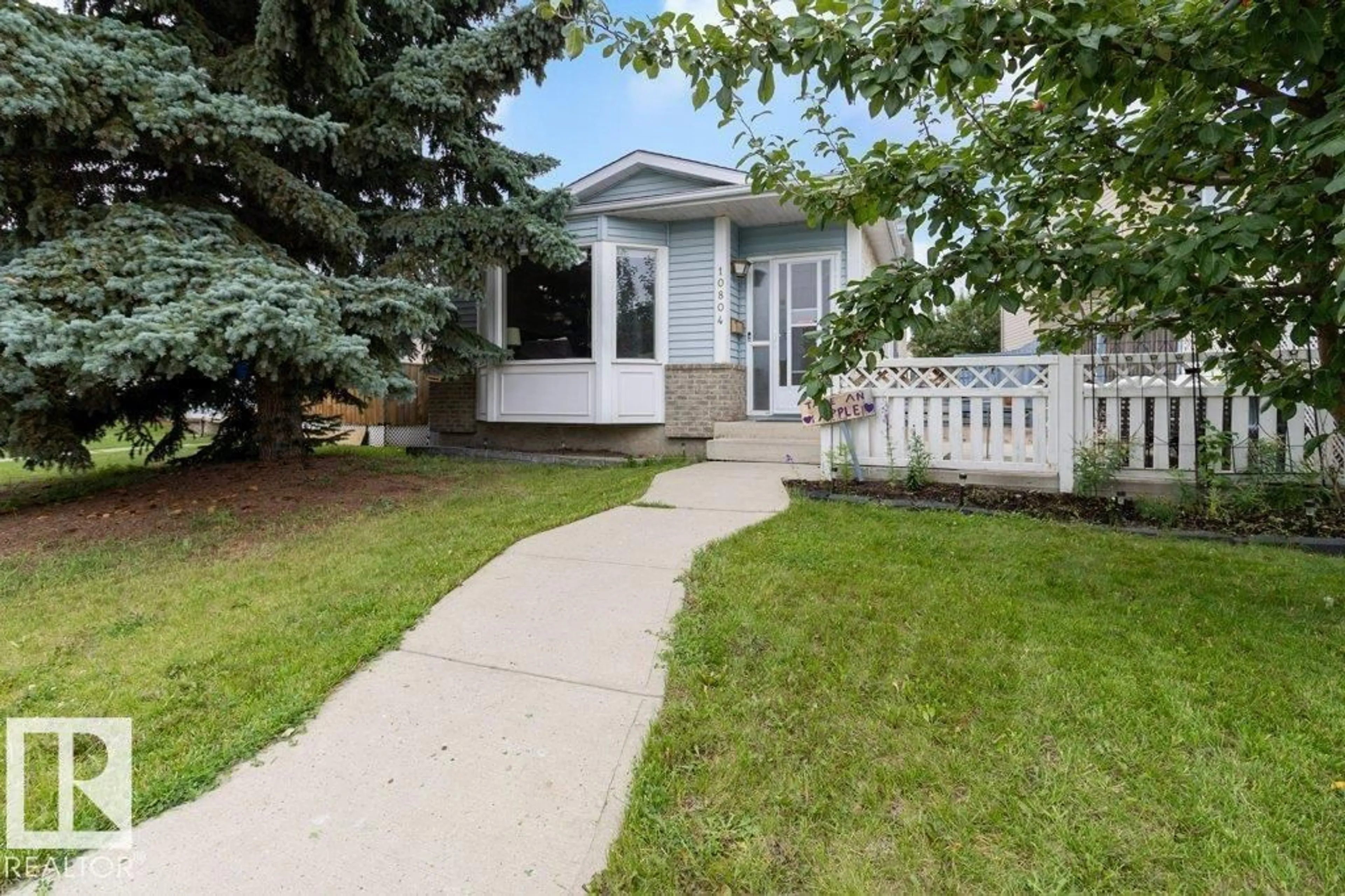 Home with vinyl exterior material, street for 10804 20 AV, Edmonton Alberta T6J5T3