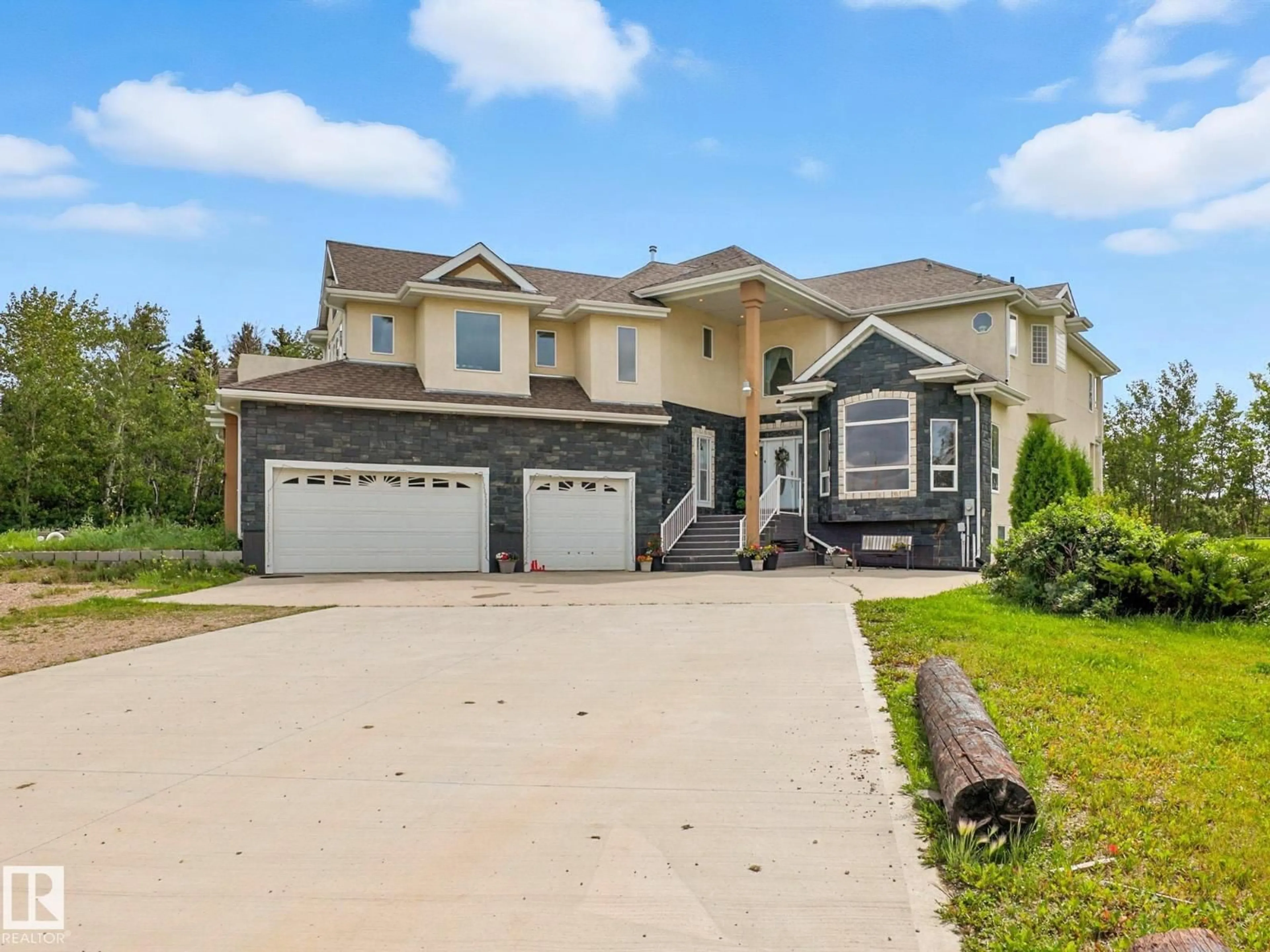 Home with vinyl exterior material, street for 52257 - 61 RGE ROAD 231, Rural Strathcona County Alberta T8B1A7