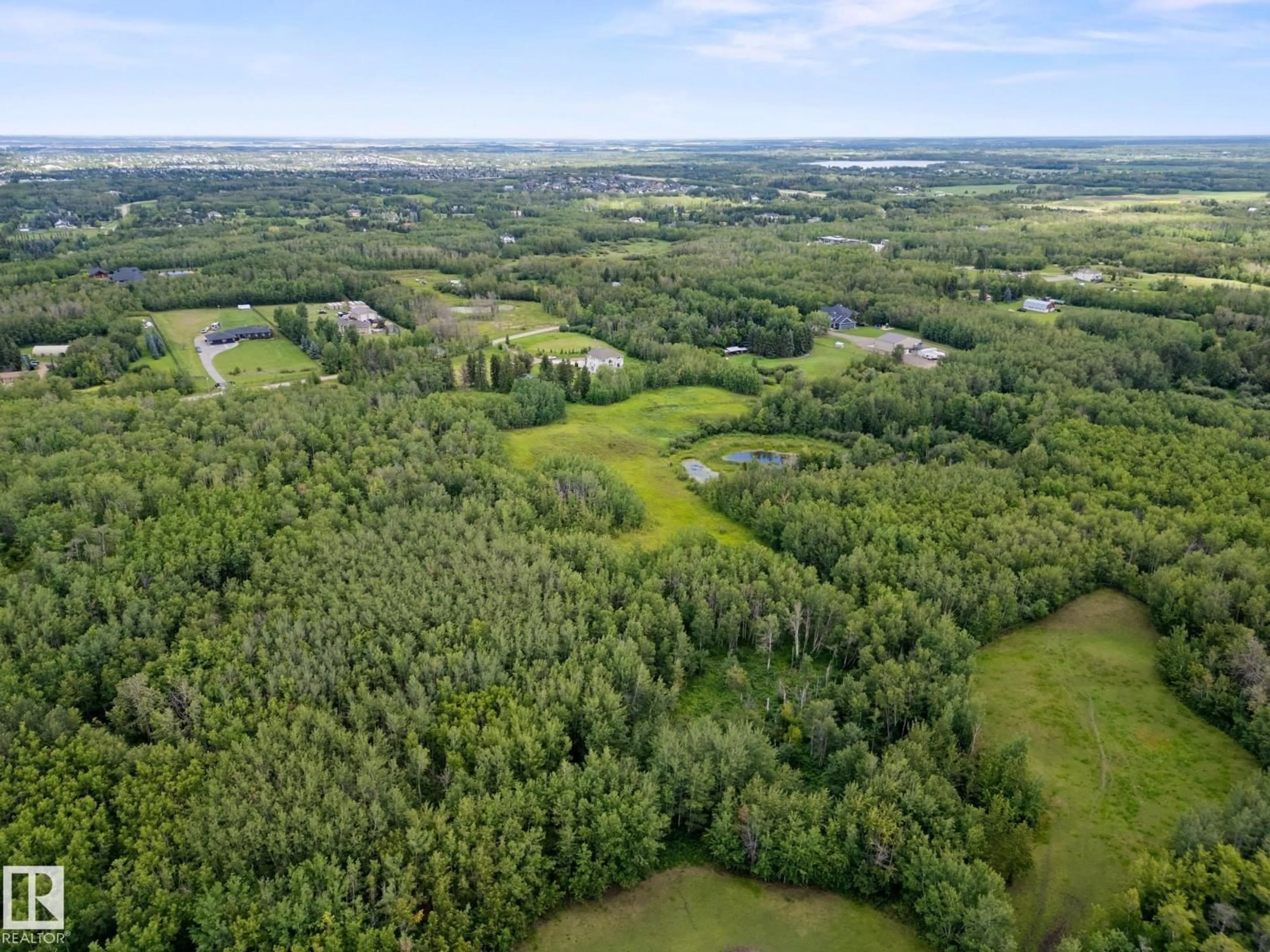 A pic from outside/outdoor area/front of a property/back of a property/a pic from drone, forest/trees view for 52257 - 61 RGE ROAD 231, Rural Strathcona County Alberta T8B1A7